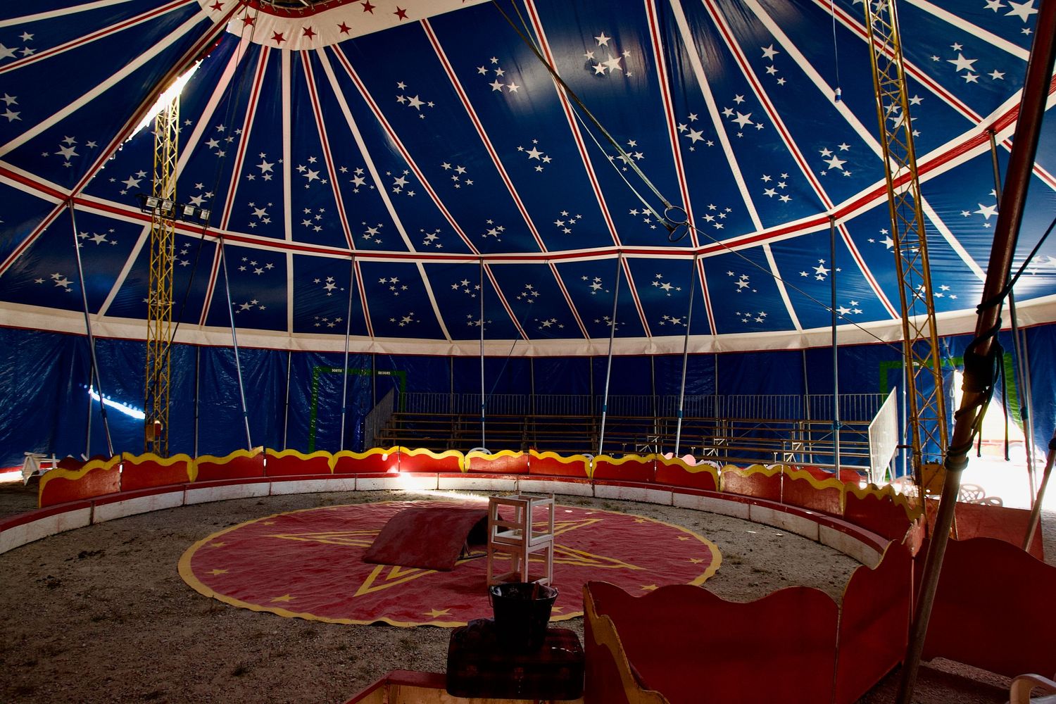 Multiple views of an ornate domed ceiling with red accents and geometric patterns.