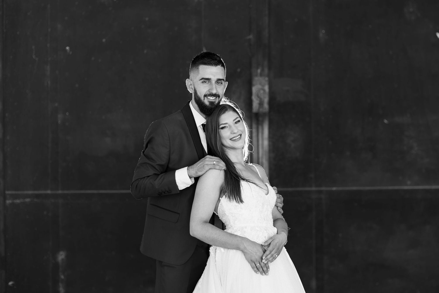A beautiful wedding photograph montage showing six romantic black and white moments between newlyweds.