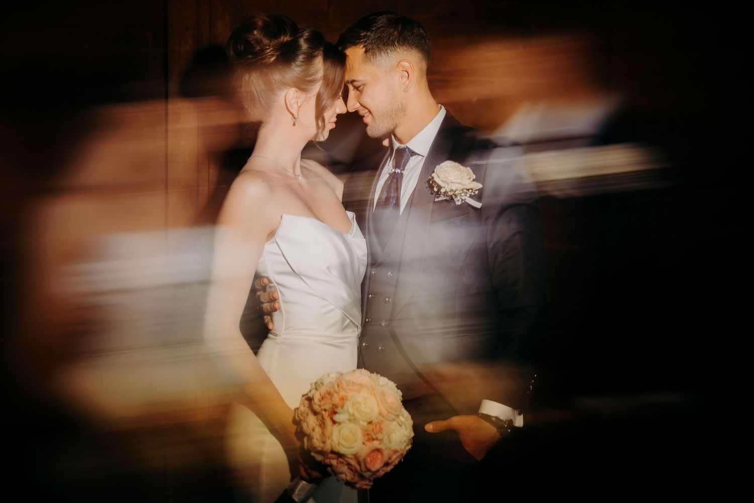 Motion blurred dance scene with multiple couples in an elegant ballroom setting captured in a dreamy photojournalistic style.