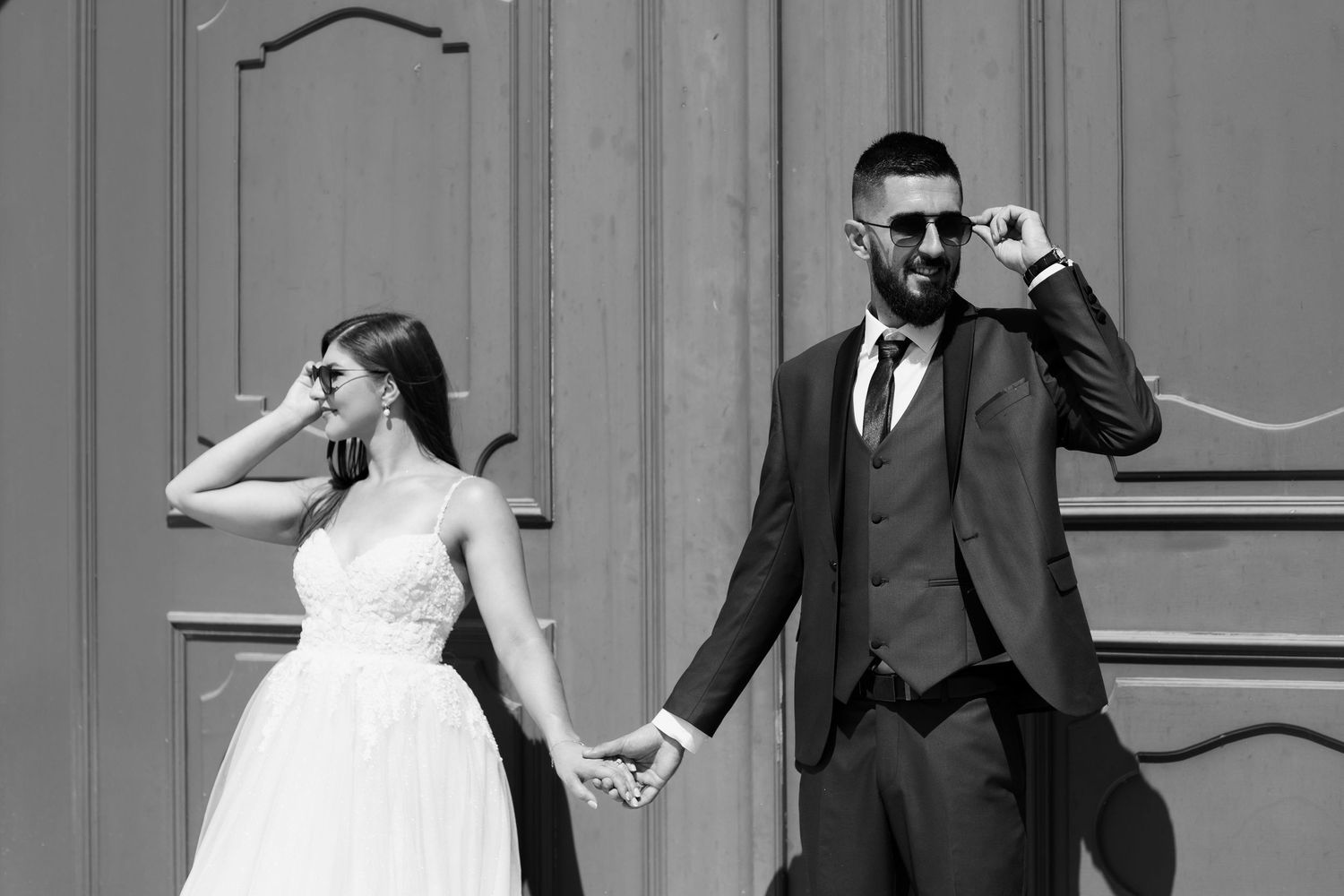 A couple shares a romantic and celebratory moment during their wedding day festivities.