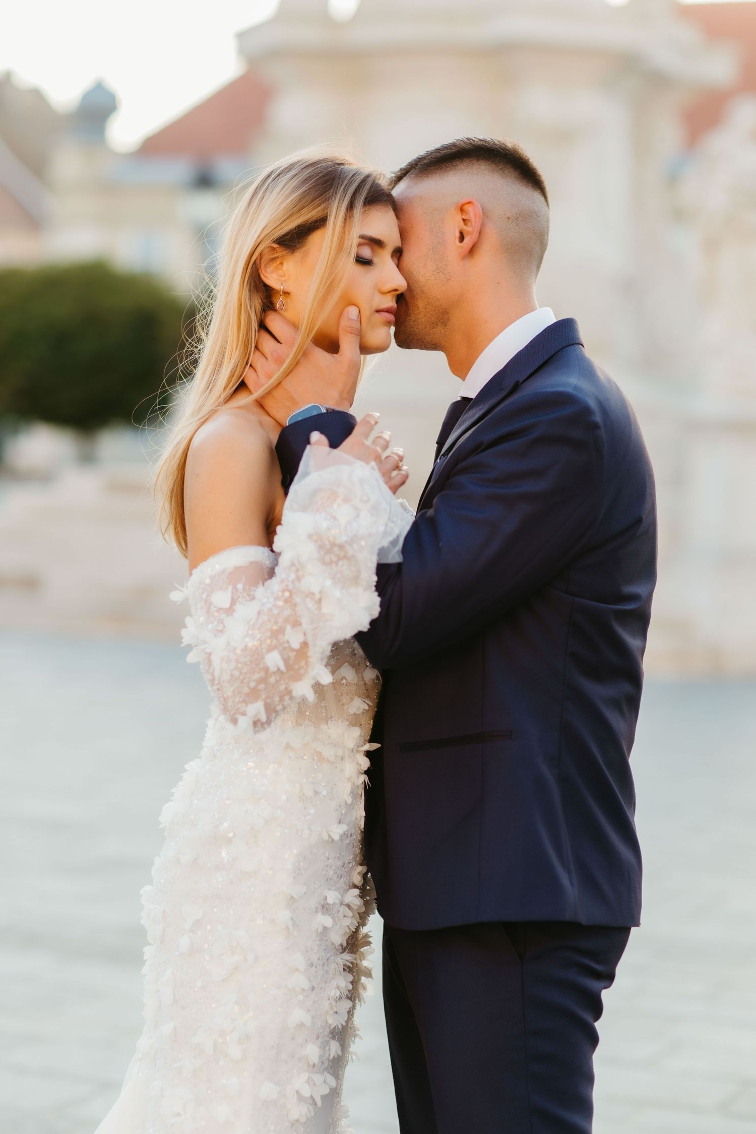 An intimate wedding portrait captured during golden hour.
