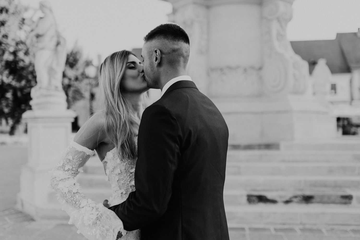 Black and white intimate wedding portrait showing tender embrace.
