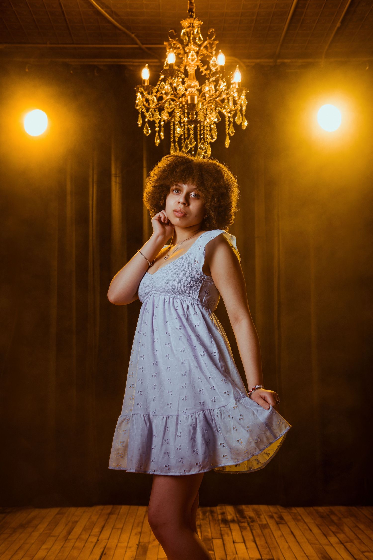 Elegant senior portrait of high school girl in studio with chandelier, New Ulm Minnesota photographer