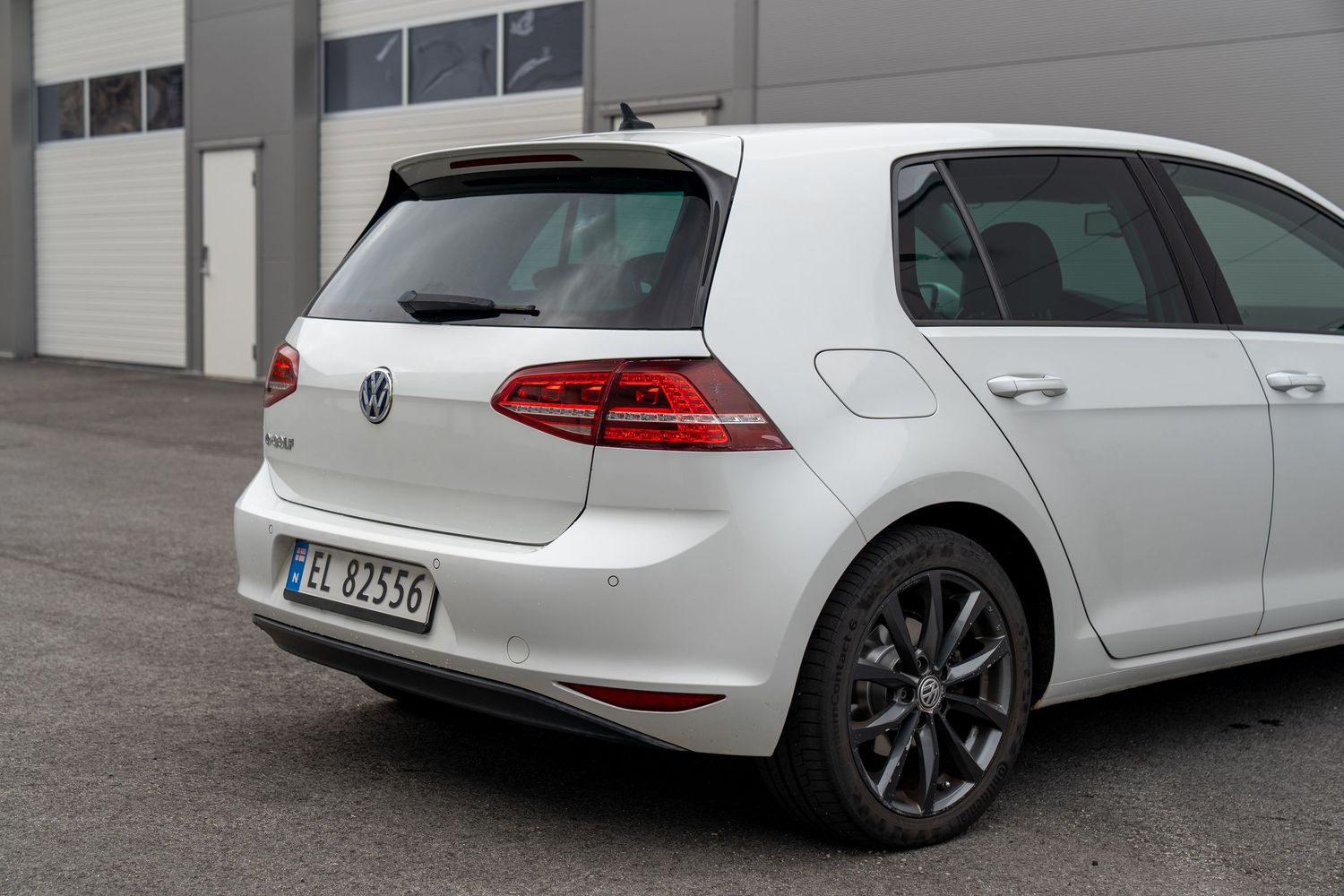 White VW Golf wagon shown from multiple rear angles displaying its sporty profile.