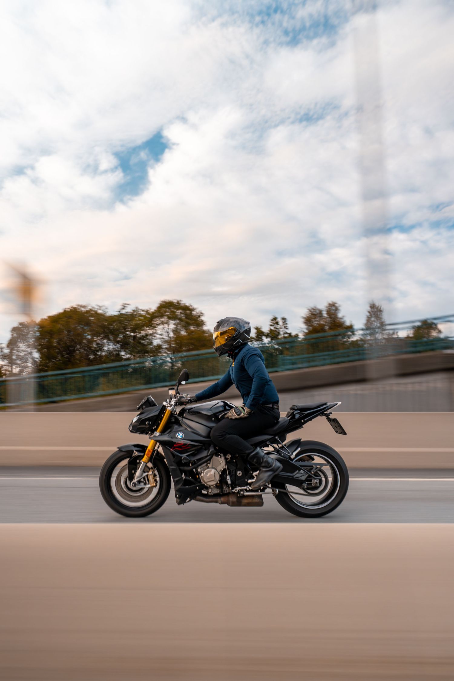 A series of motorcycle riding sequence shots showing a rider in motion on a highway during golden hour.