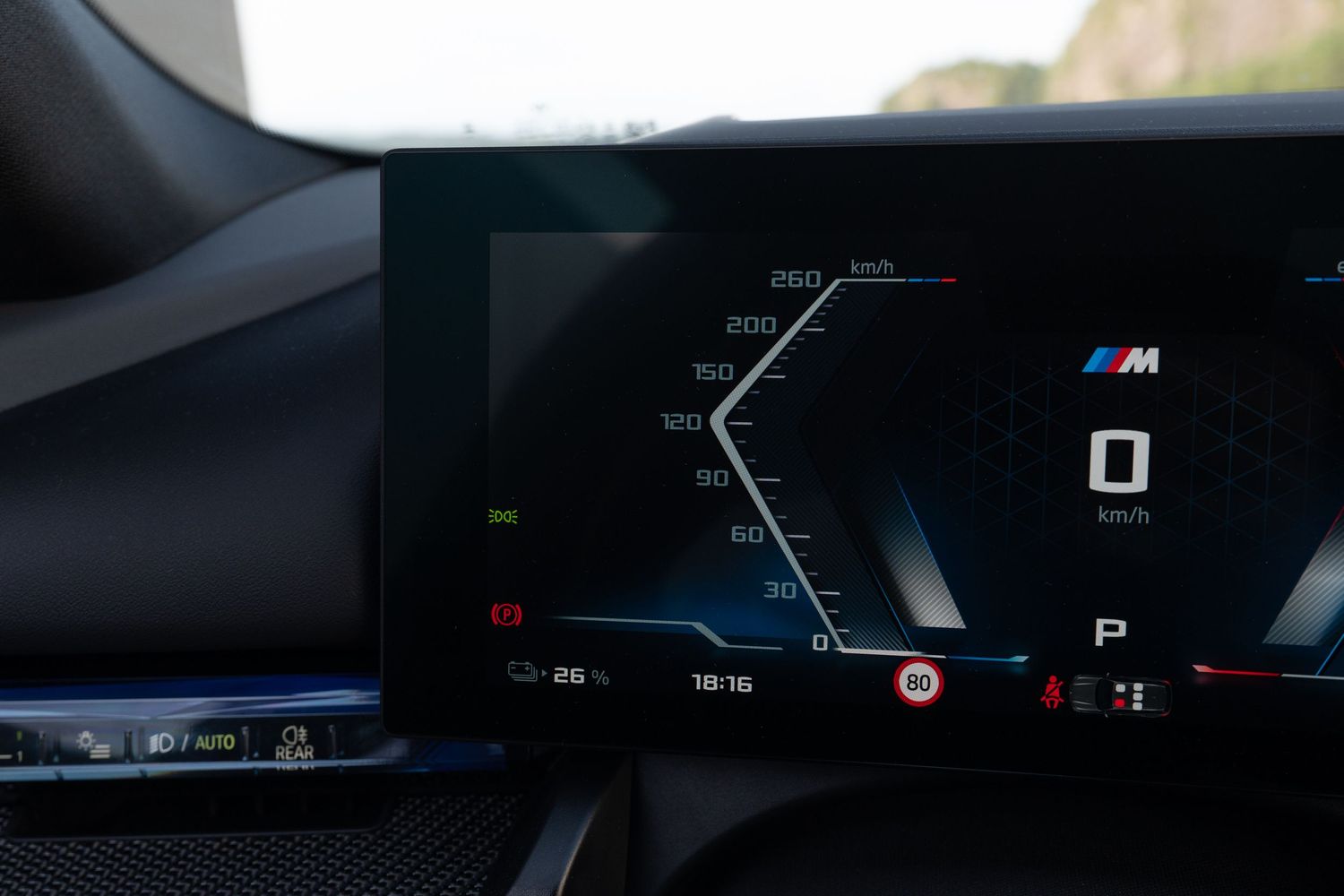 Digital navigation display showing route guidance with BMW M performance branding.