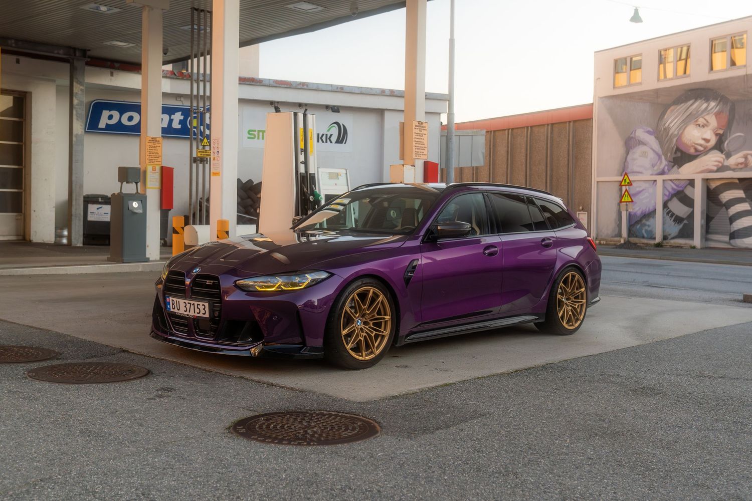 Four views of a modified purple BMW M4 with gold wheels photographed at a gas station at night.