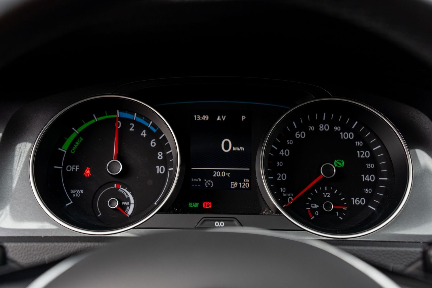 Digital dashboard instrument cluster display showing green and white illuminated gauges and indicators.