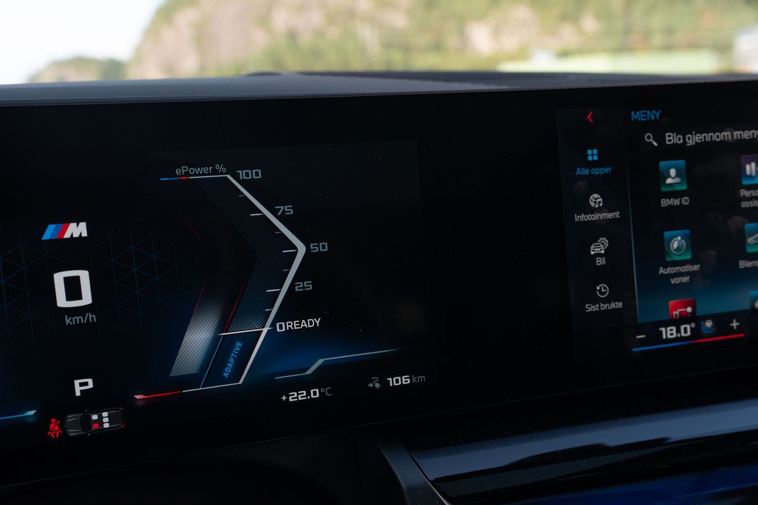 BMW M-series digital dashboard showing performance gauges and driving information at night.