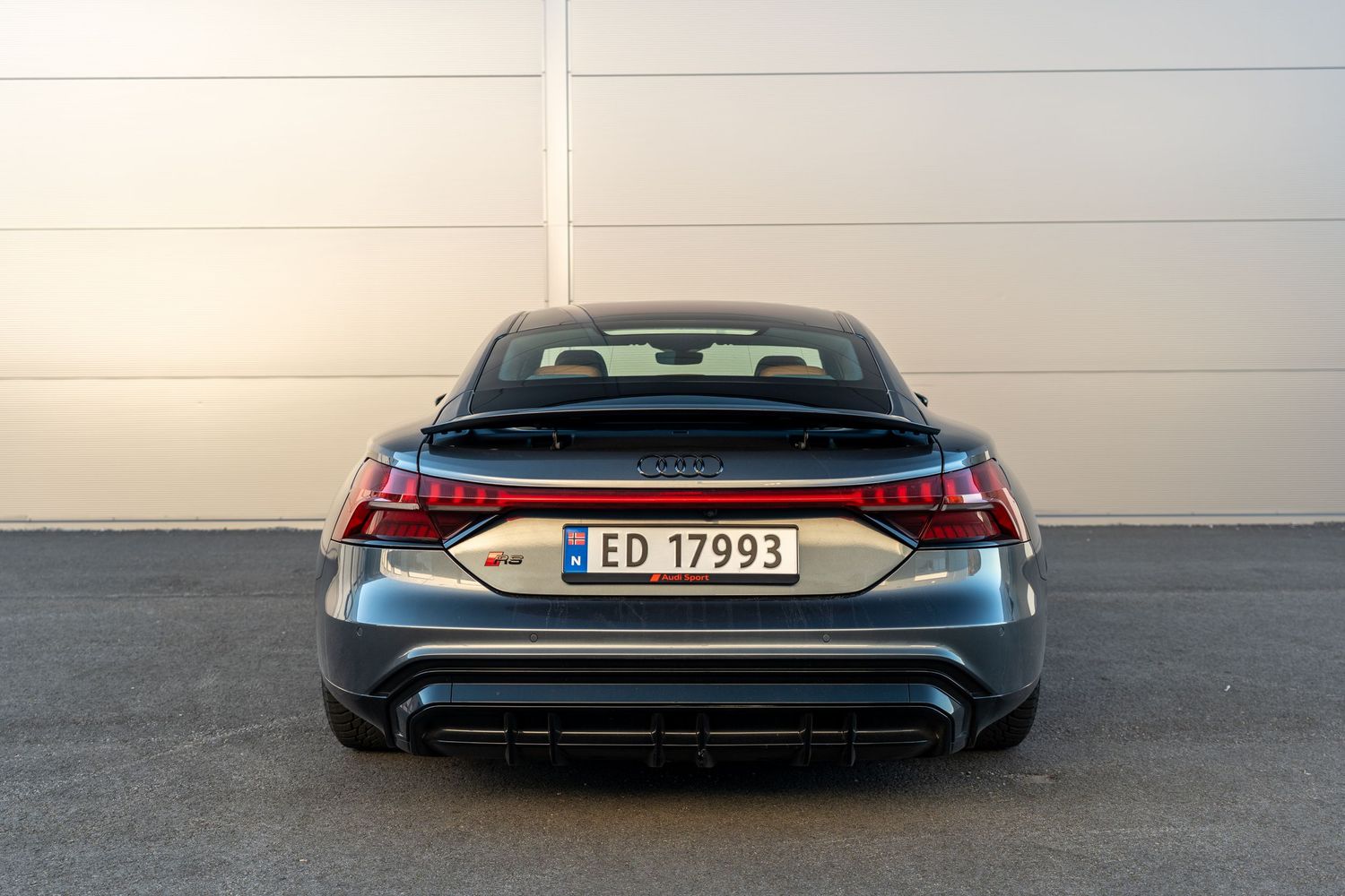 Direct rear view of Audi RS e-tron GT showing full width LED light bar and license plate.