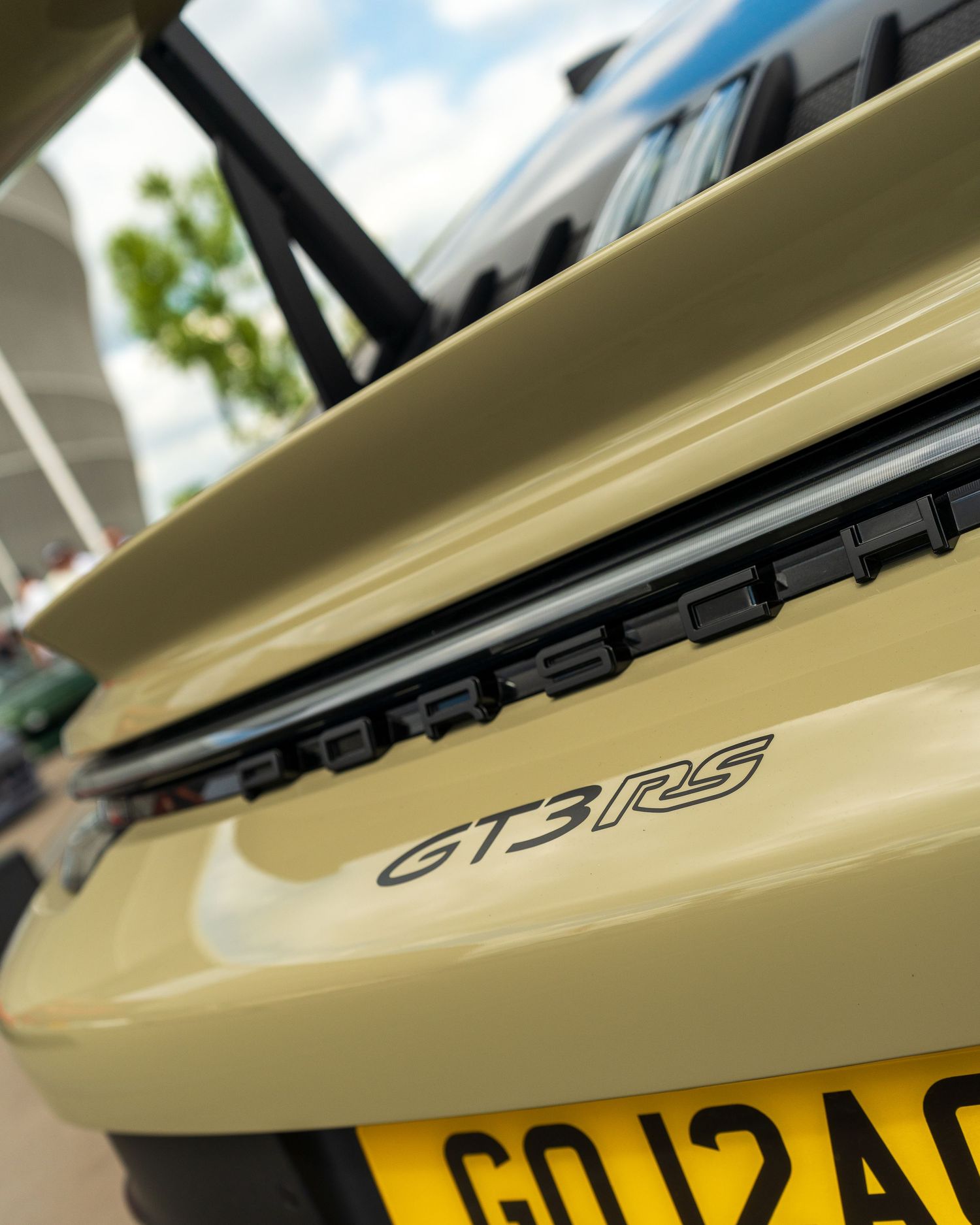 Close-up detail shots of GT-R3 badging on a cream-colored performance vehicle.
