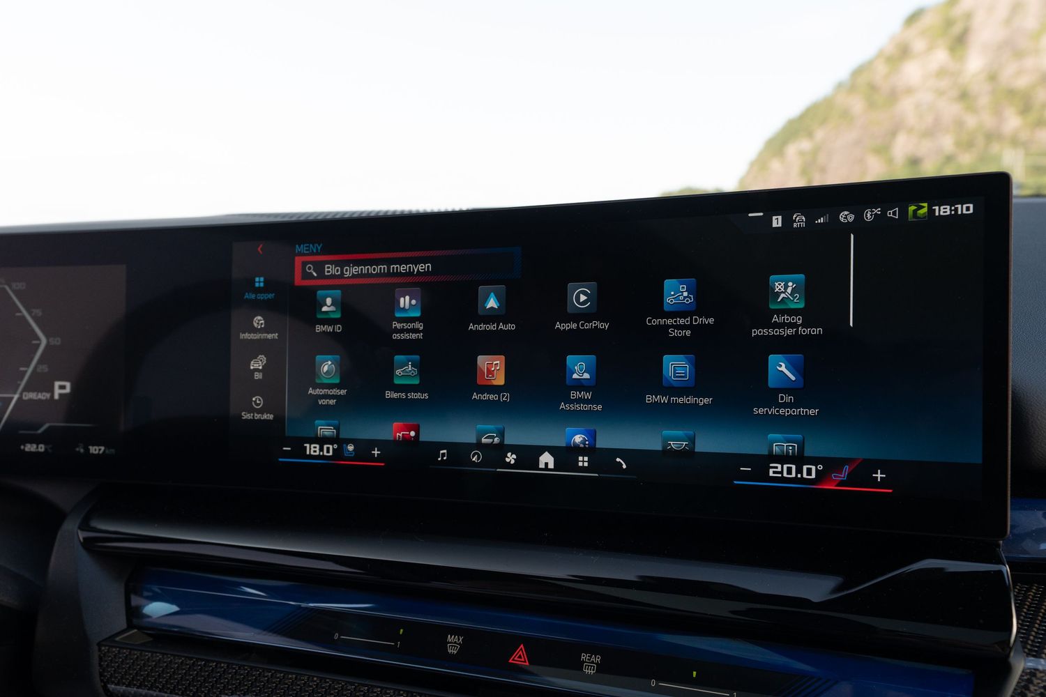 Extended display screen showing entertainment and vehicle control interface in a modern car dashboard.