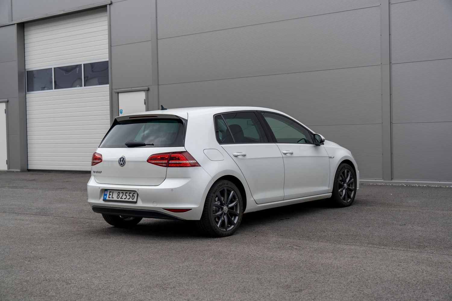 White modified Volkswagen GTI shown from different angles demonstrating varied suspension heights and stances.