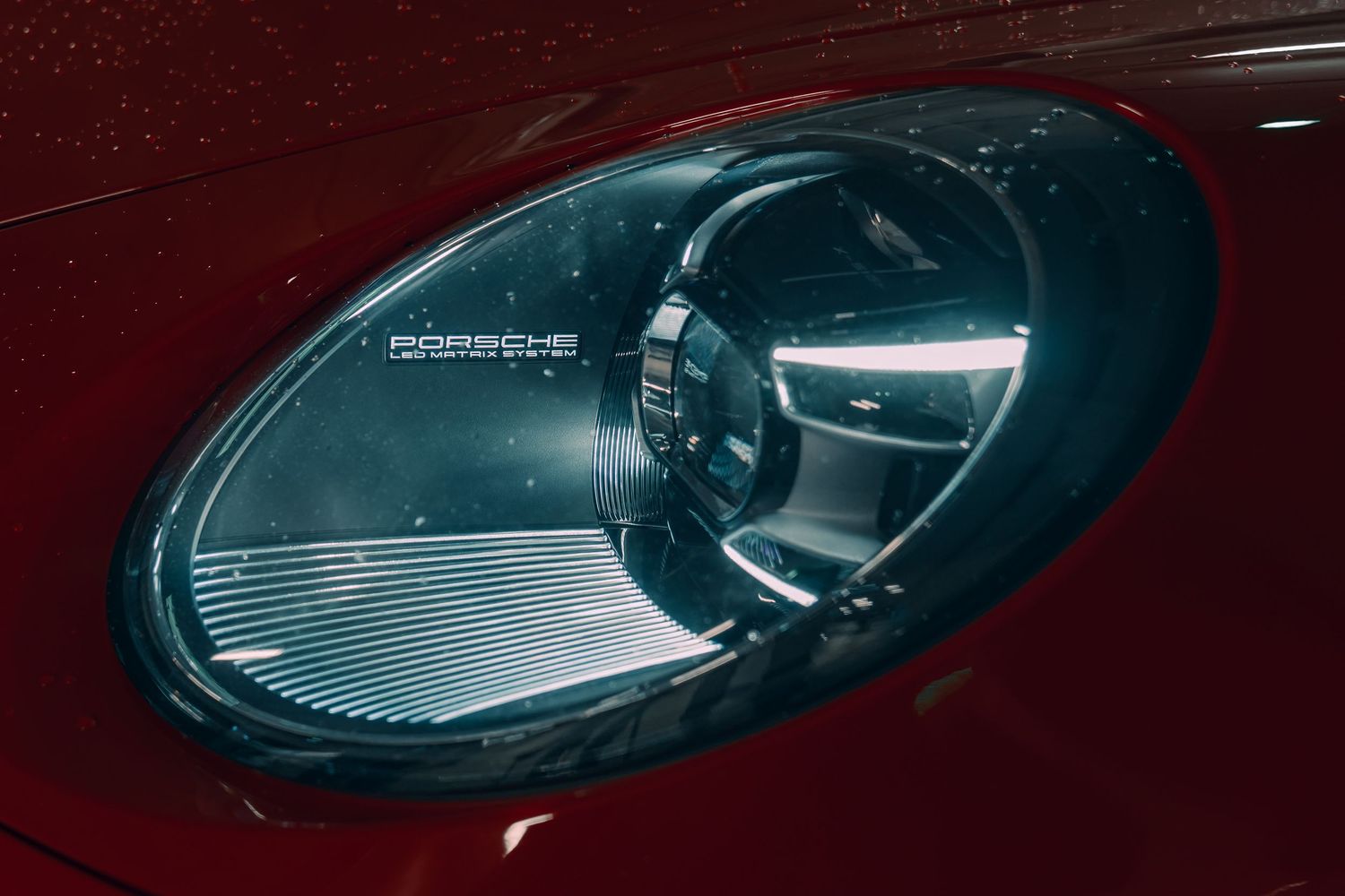 Close-up detail of a modern sports car headlight with LED technology.