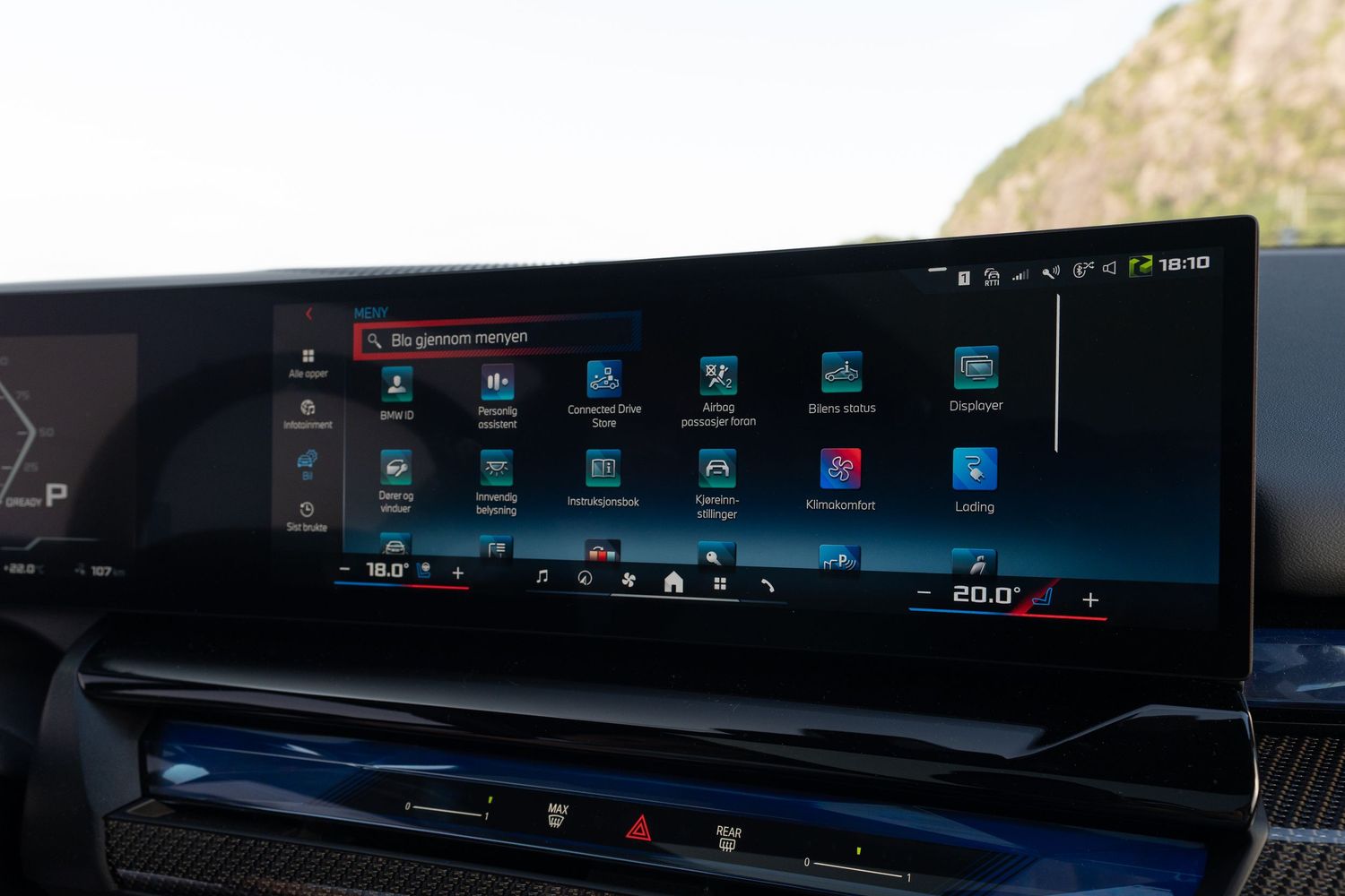 Wide curved digital display screen showing navigation and vehicle information in a luxury car interior.