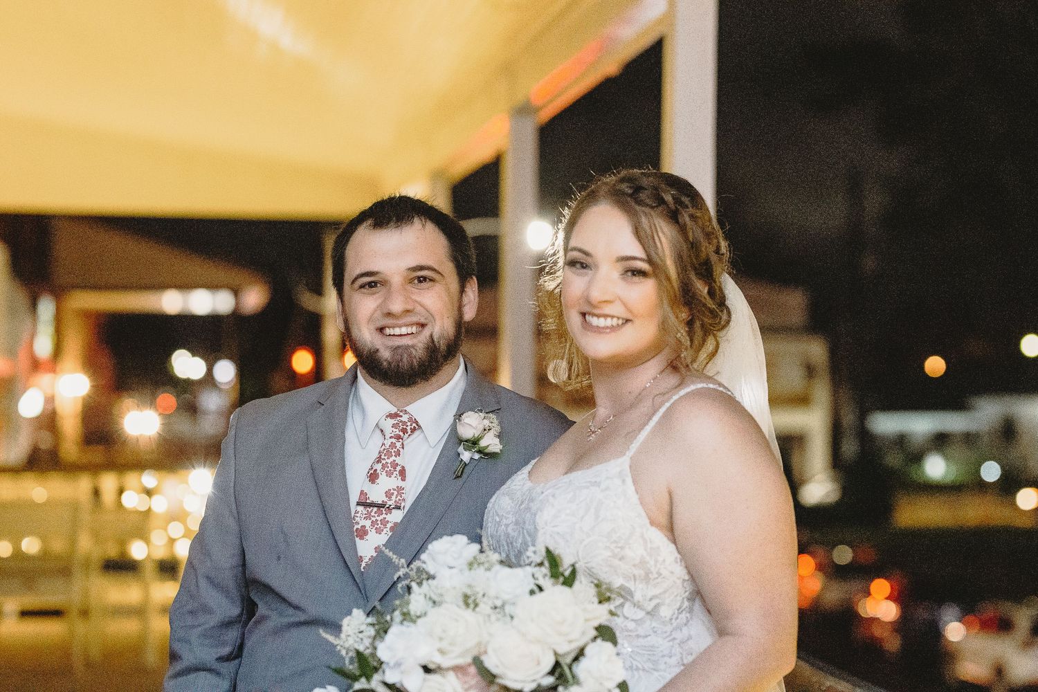 A wedding celebration at night with warm lighting and joyful atmosphere.