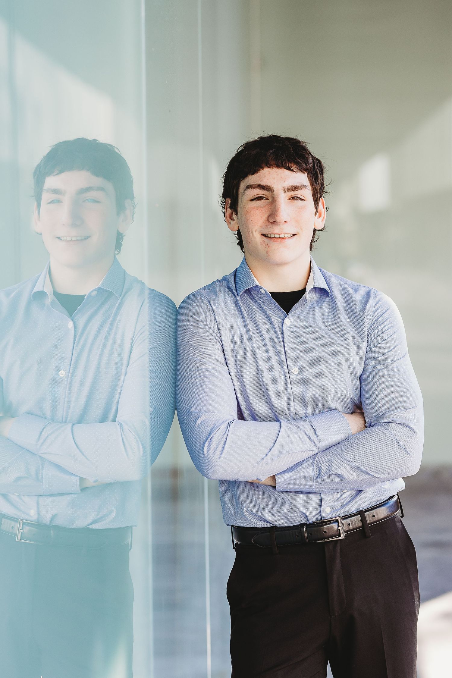 A creative portrait with a reflection showing a professional in business attire.