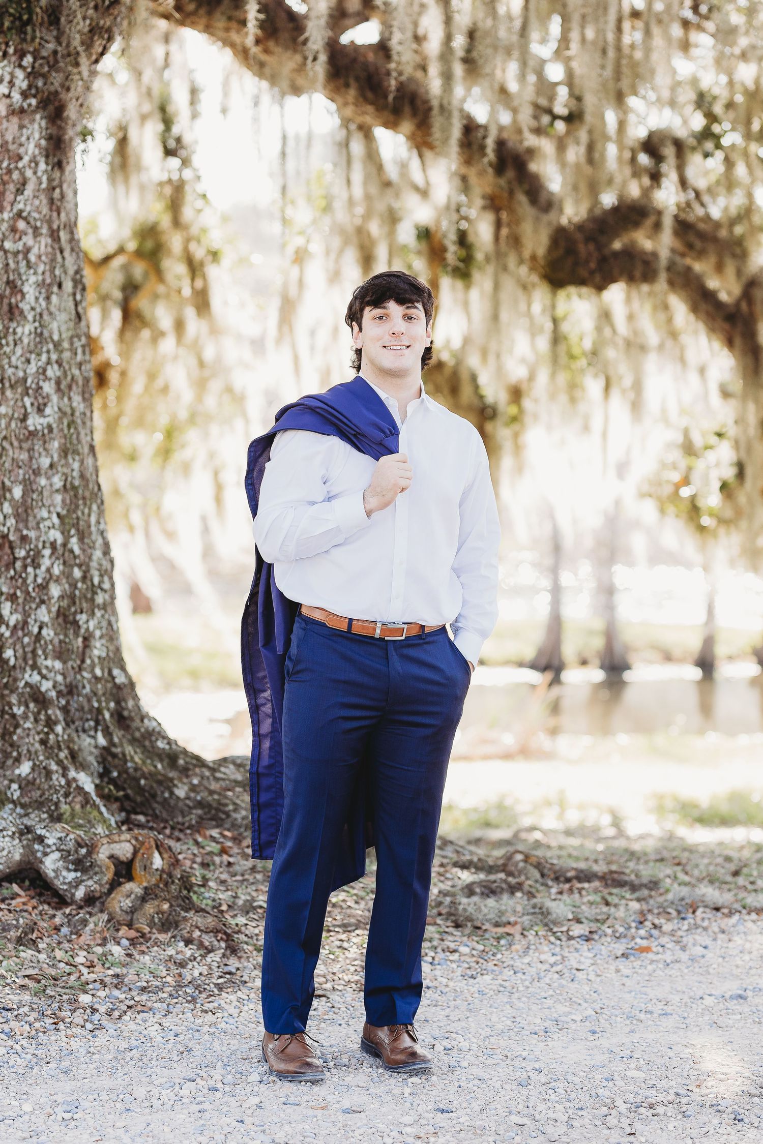 Series of poses in formal attire against scenic outdoor backdrop with Spanish moss.