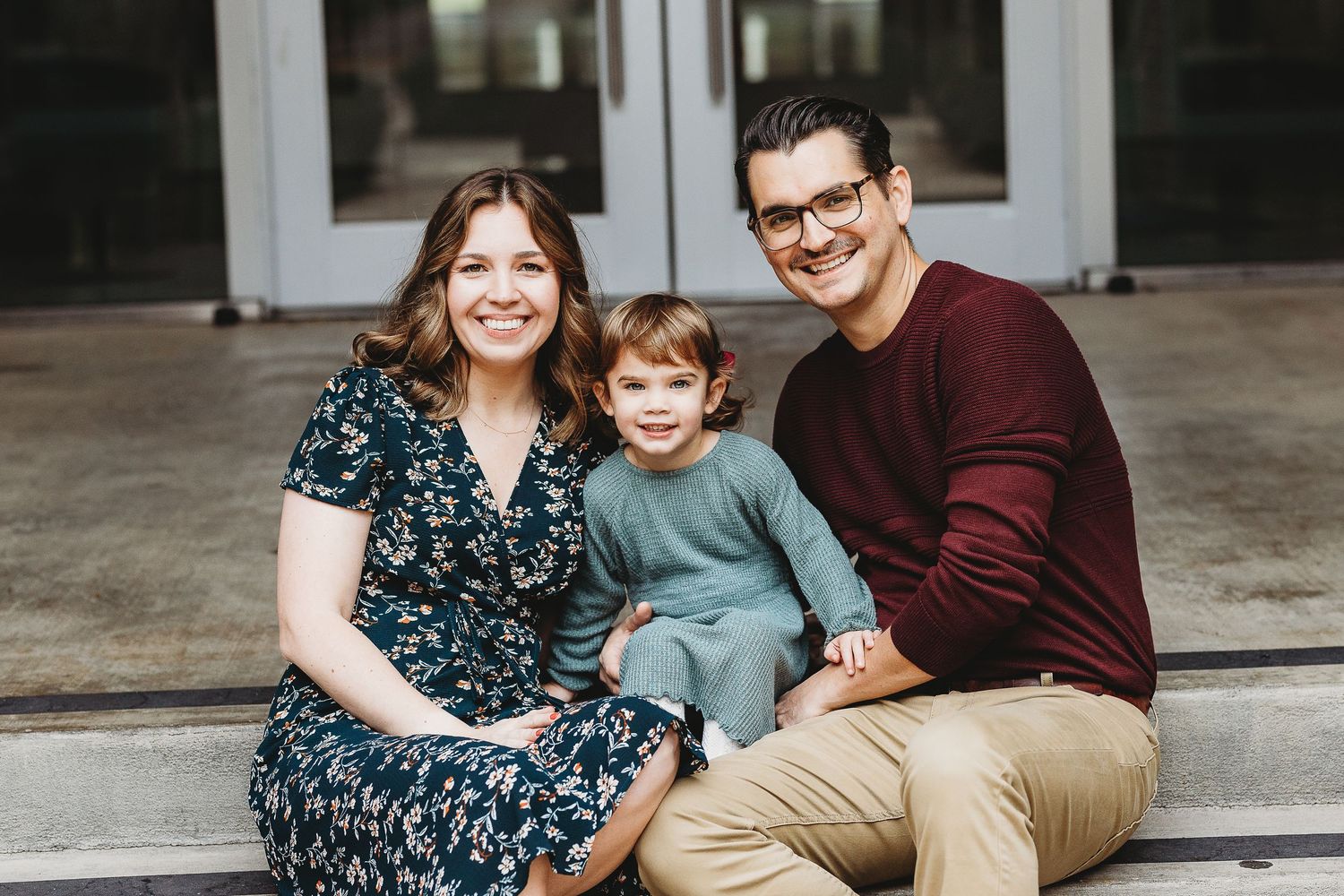 Indoor family portrait session with casual poses and natural lighting.