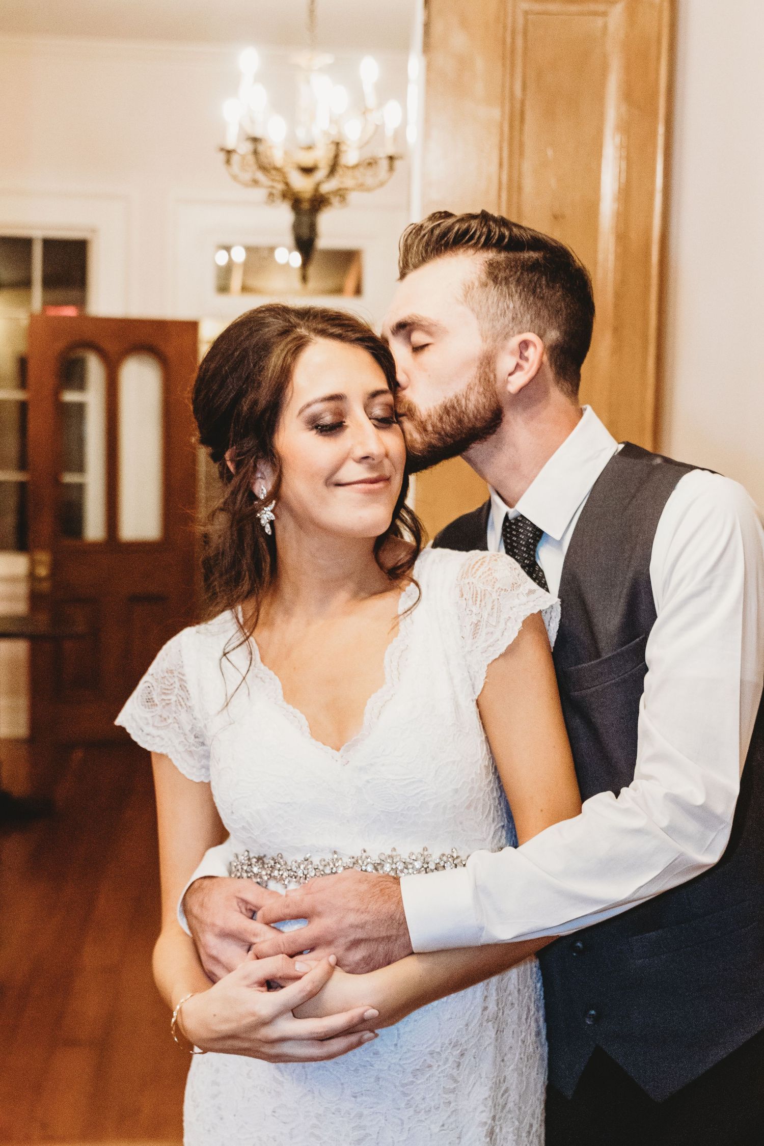 Romantic dance moments captured between newlyweds in an elegant venue.