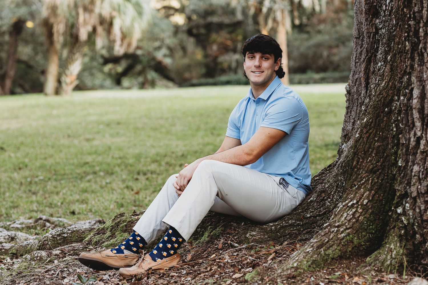 Portrait series in outdoor setting with trees and fallen leaves.