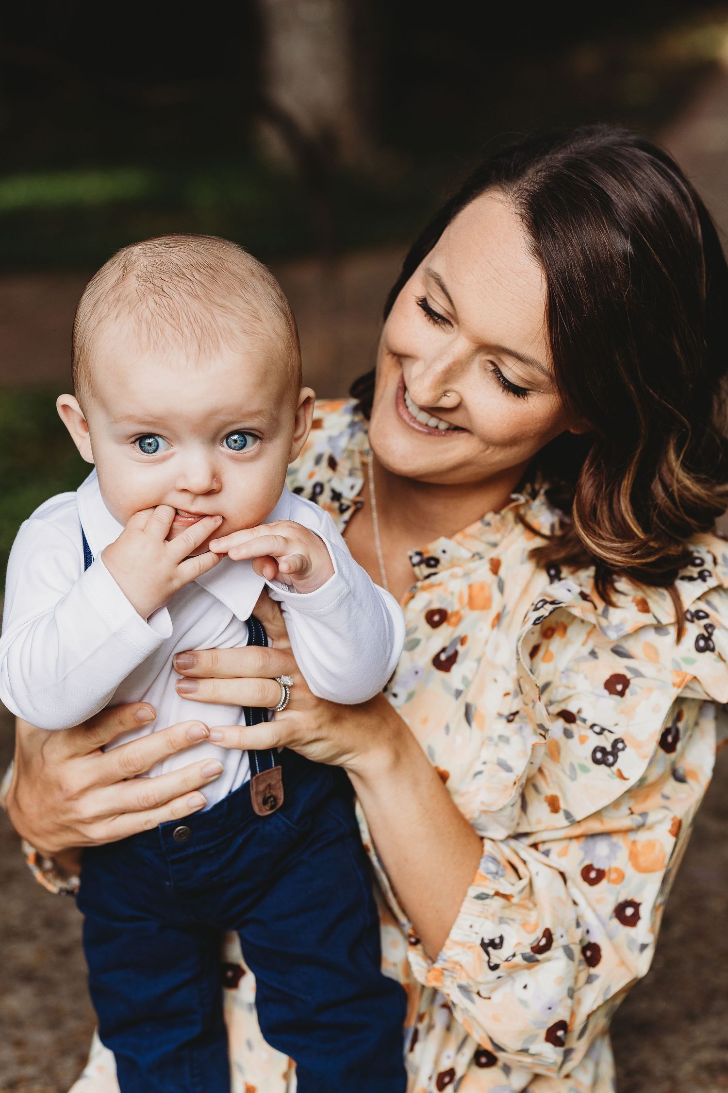 Candid outdoor portrait sequence showing playful interaction between parent and child.