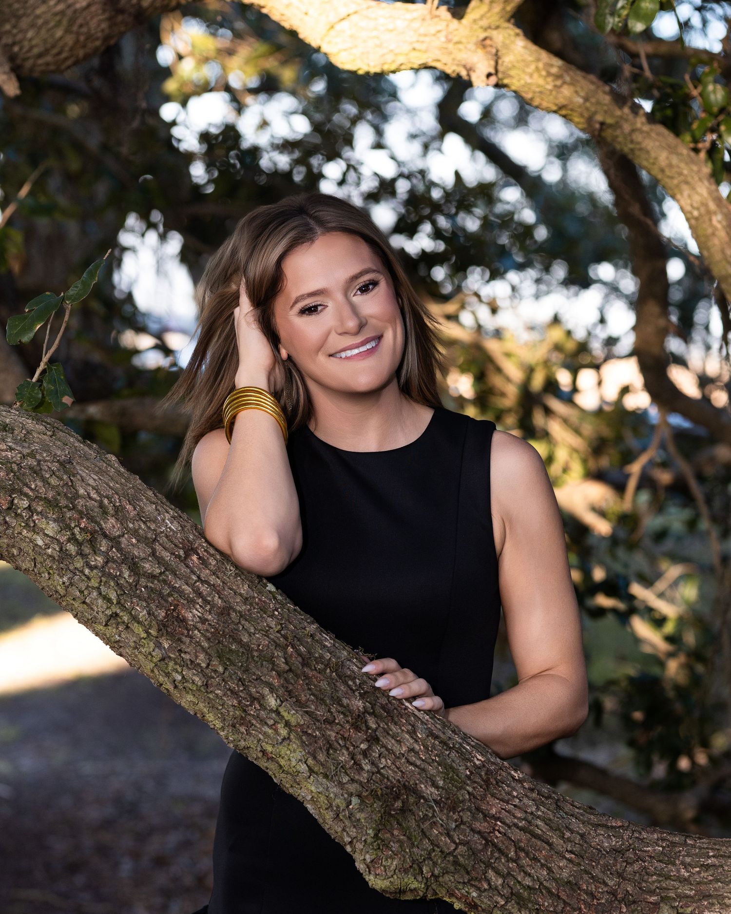 A series of outdoor portrait photographs showing someone resting against a tree branch in natural lighting.