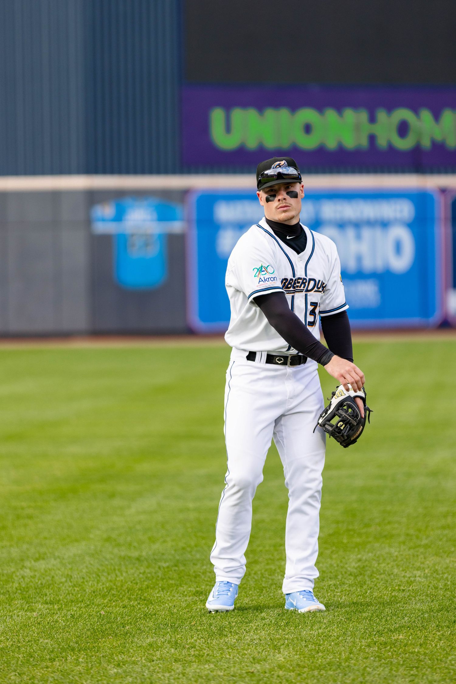 Travis Bazzana warming up for the Akron Rubber Ducks photographed by Mal McCrea Photo