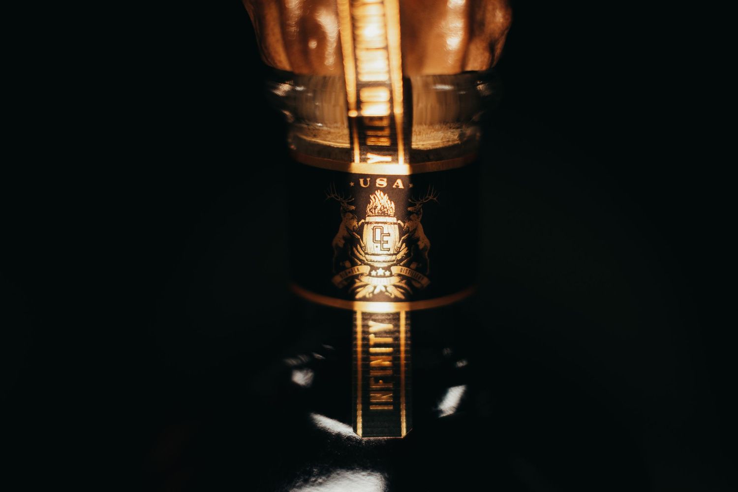 Close-up of illuminated vintage light filament against dark background.