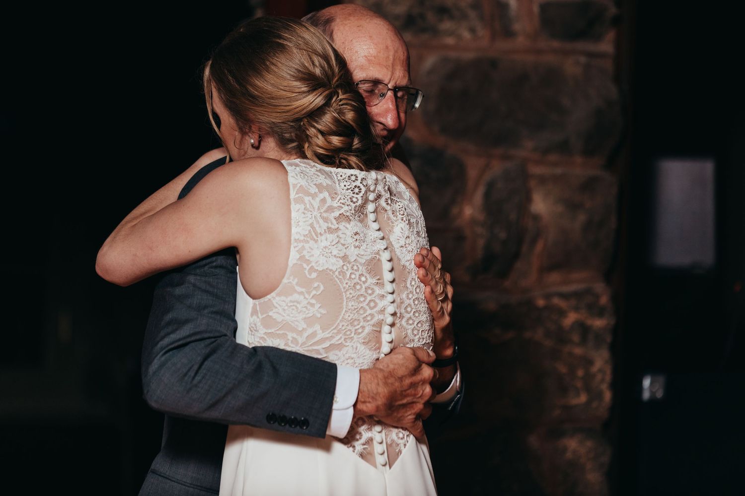 Emotional black and white photo of tender moment during wedding dance.