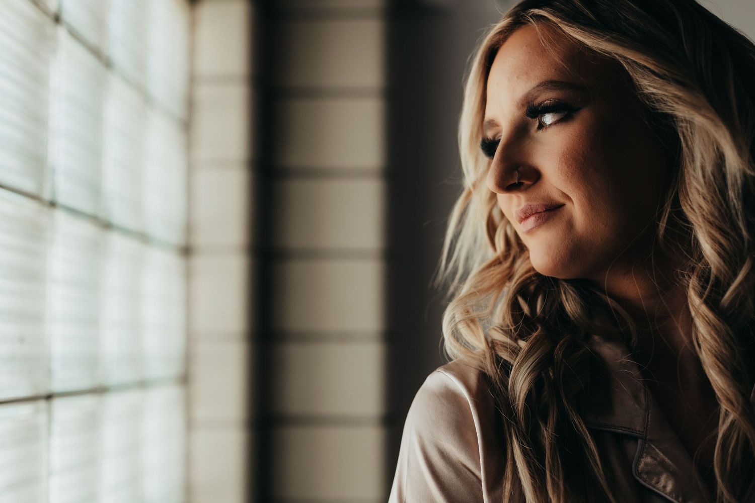 Artistic window light portrait with soft natural illumination.