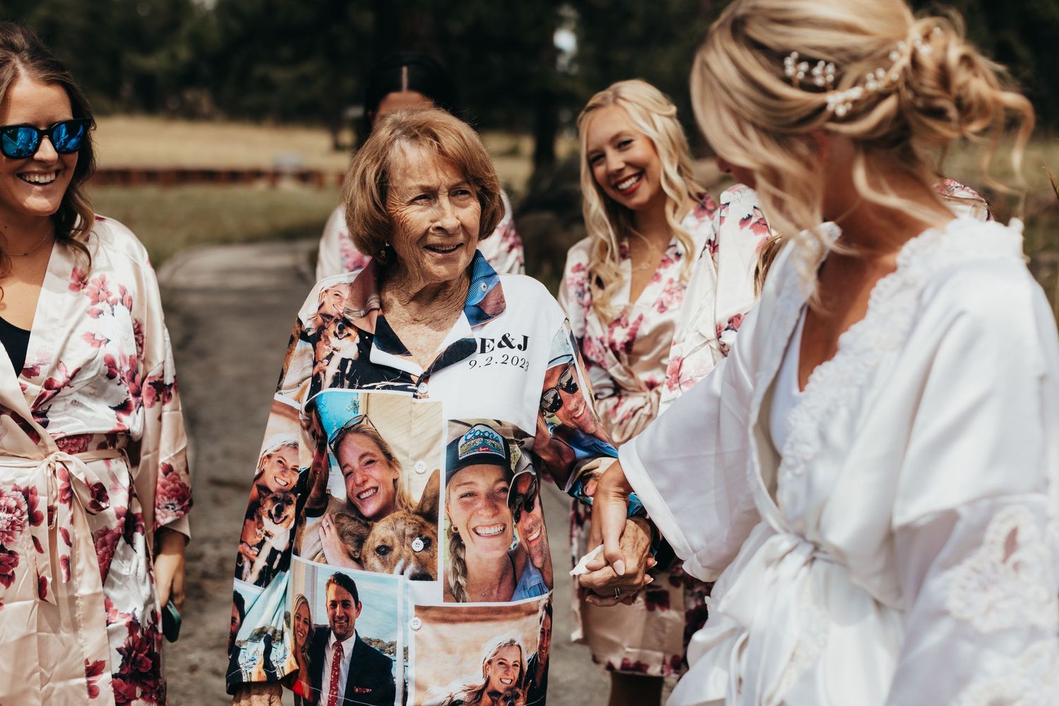 Group wearing floral robes during wedding preparation festivities.