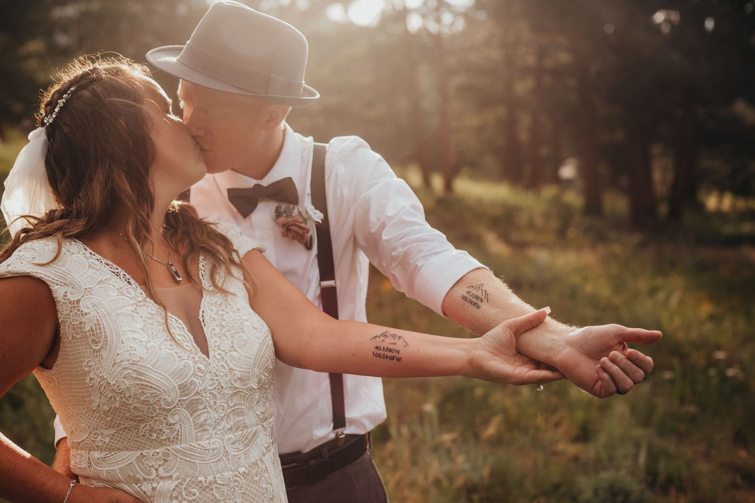 A joyful moment shared during an outdoor wedding celebration at sunset.