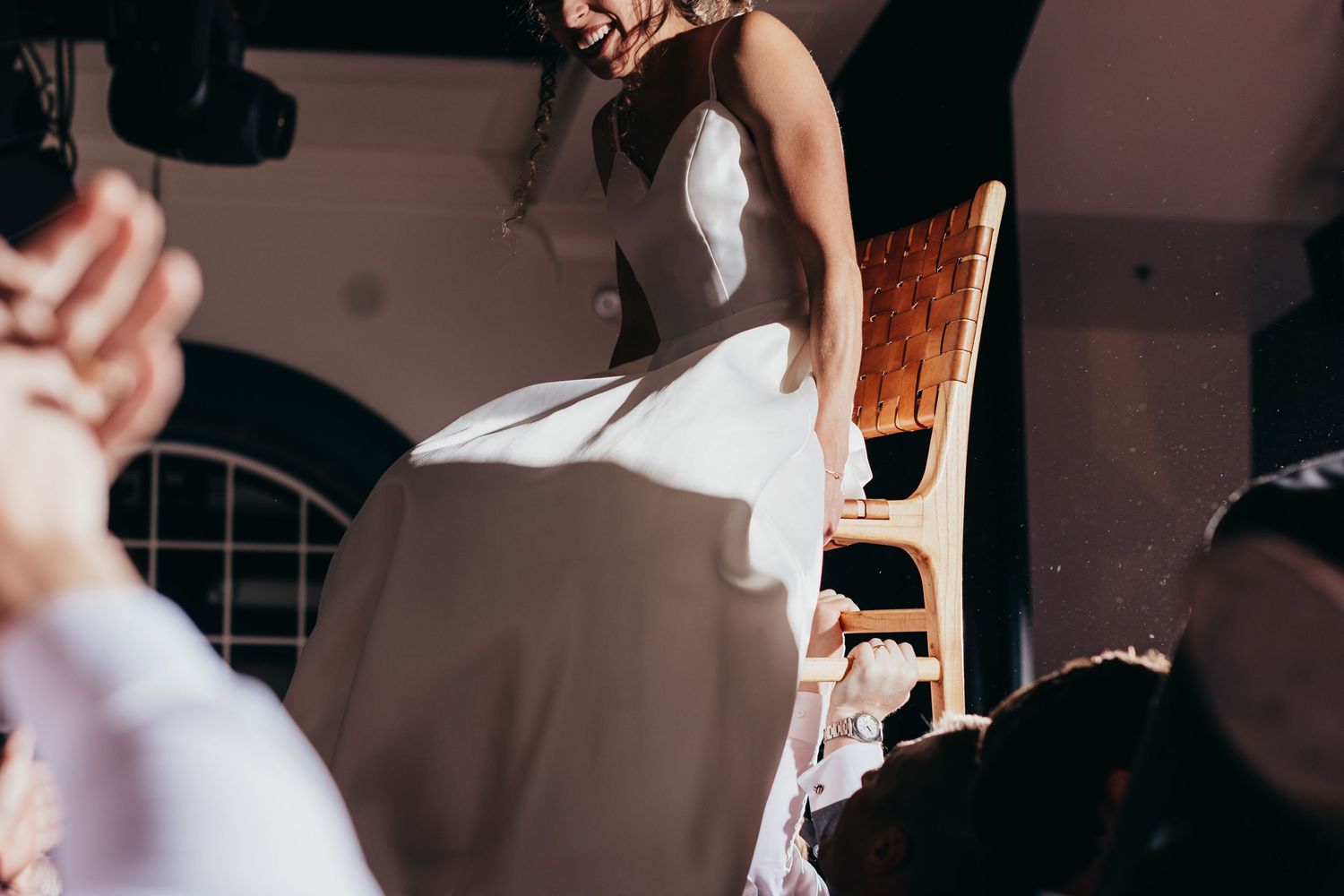 High-angle view of wedding celebration with white dress in motion.