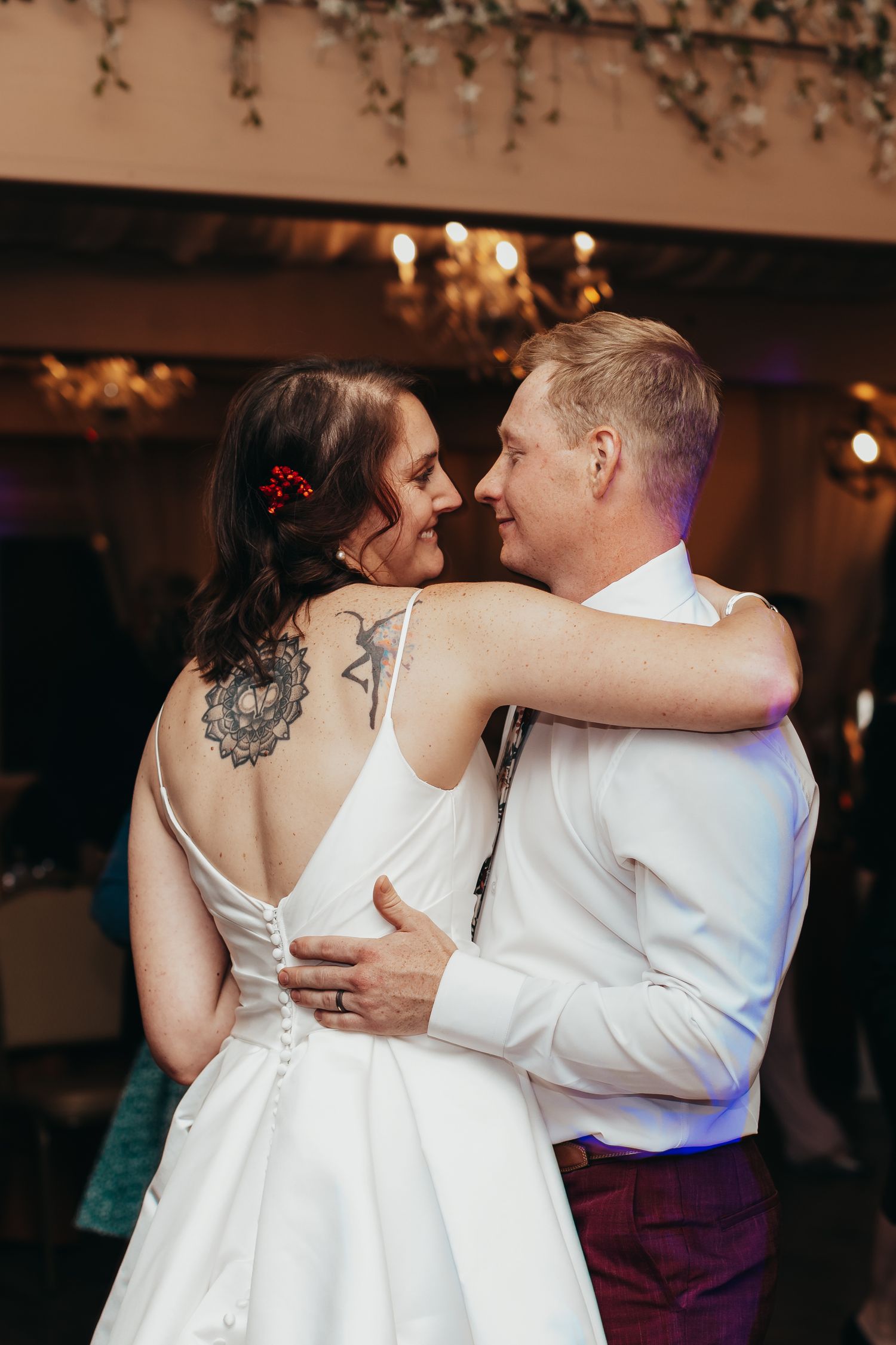 A couple sharing an intimate dance moment at their wedding reception.