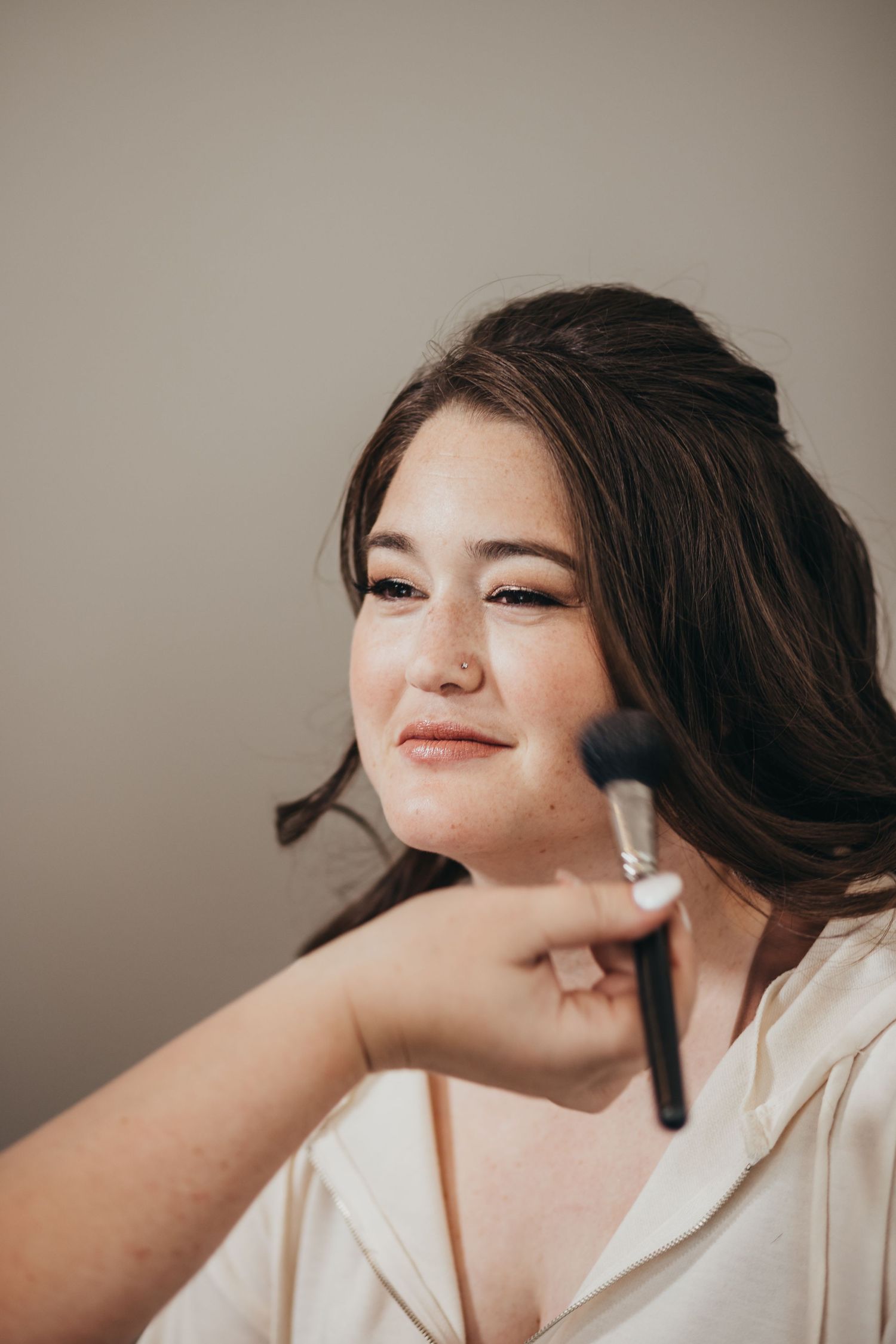 Professional makeup application during bridal preparation.