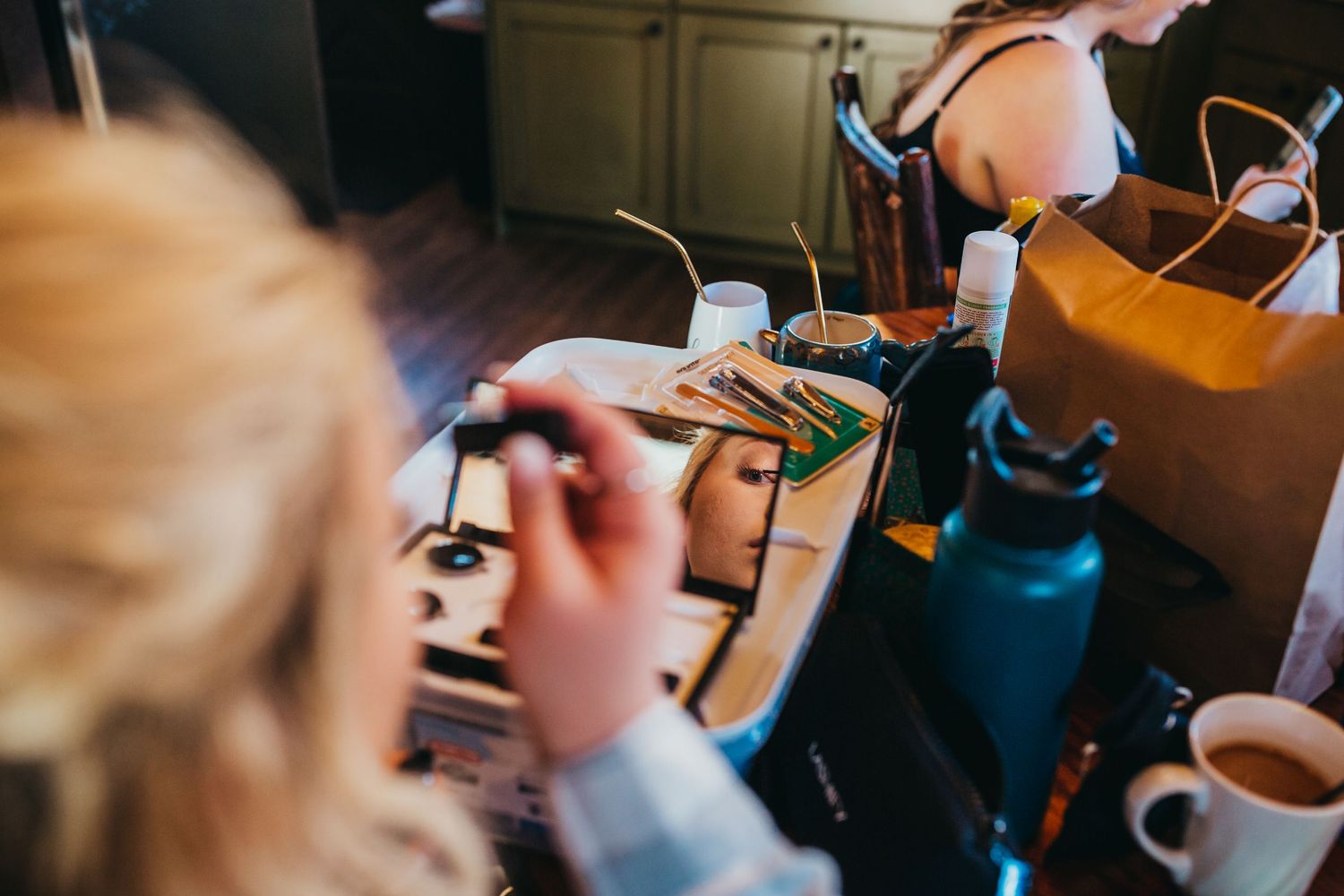 Close-up view of hands working on soldering electronics with tools and equipment.