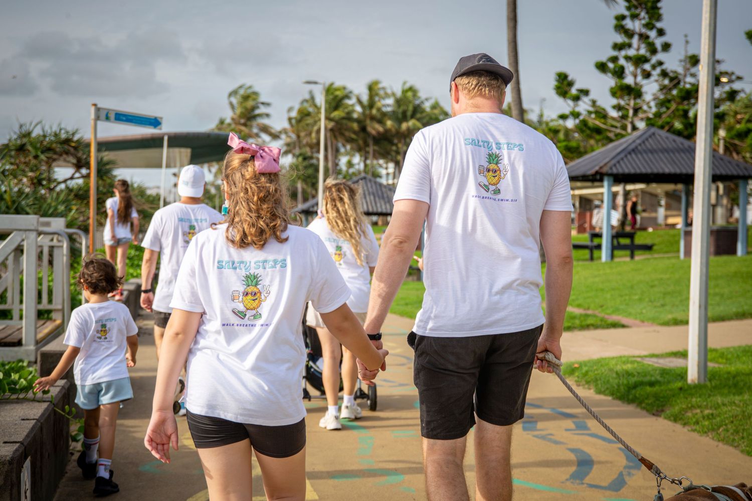Children and adults enjoying community wellness walk
