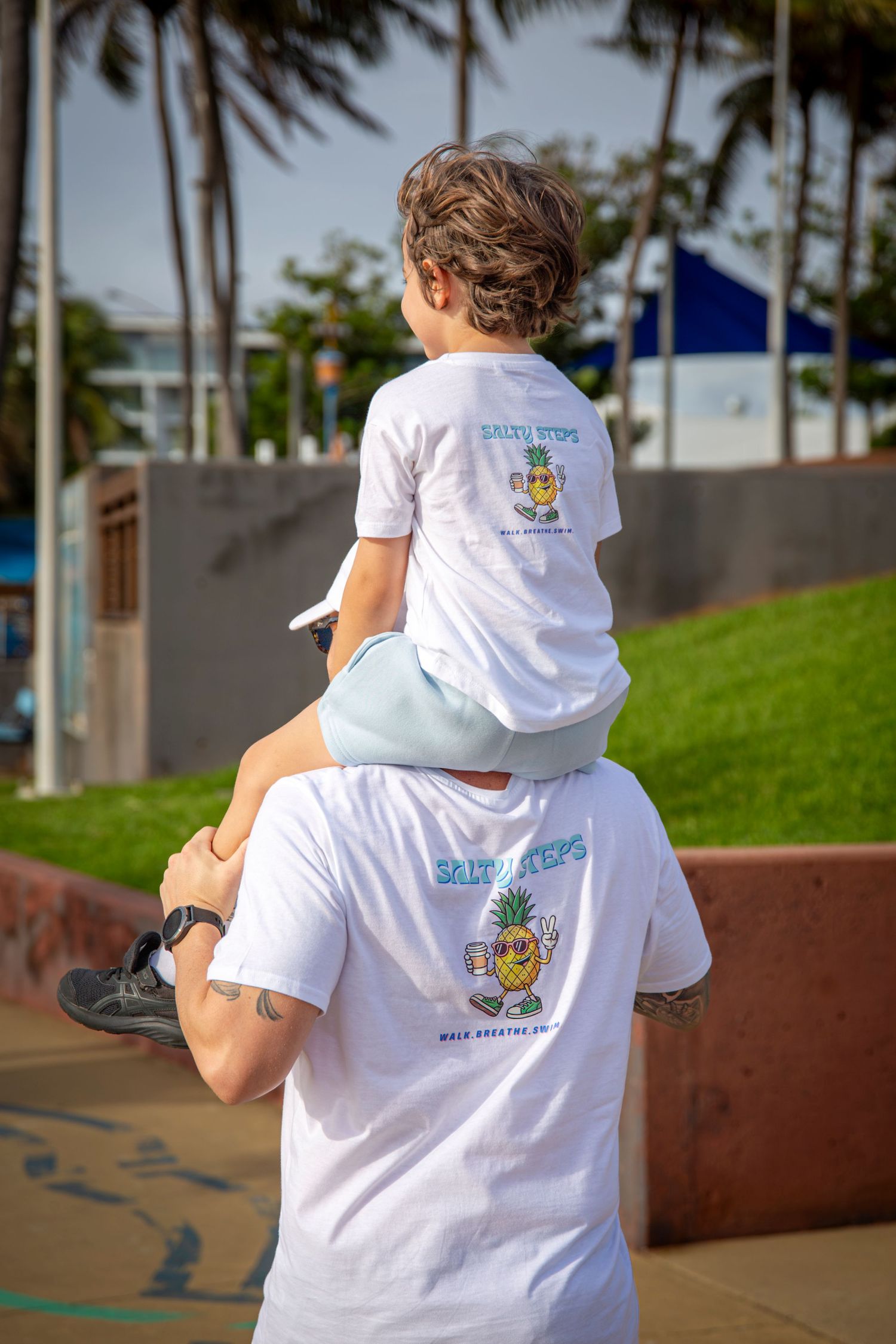 Child on Parents shoulders
