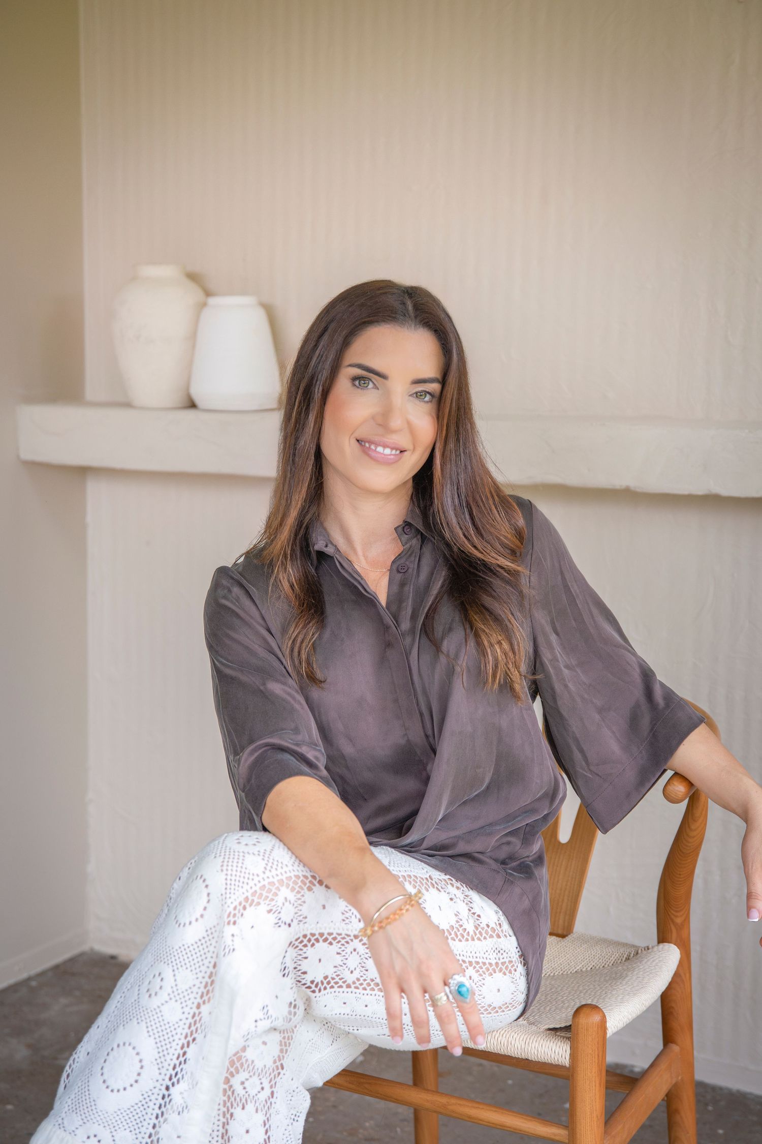 Professional modern headshot of a woman in a minimalist studio setting in Rockhampton