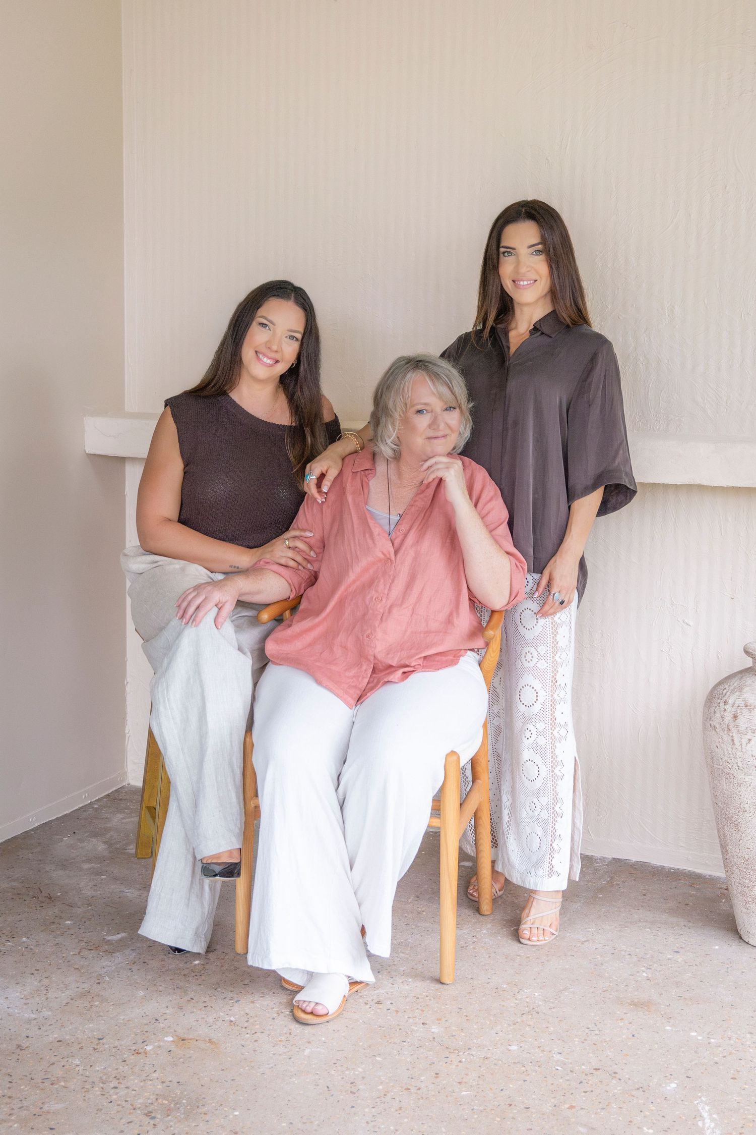 Three women together in a bright Rockhampton studio during a modern headshot photography session