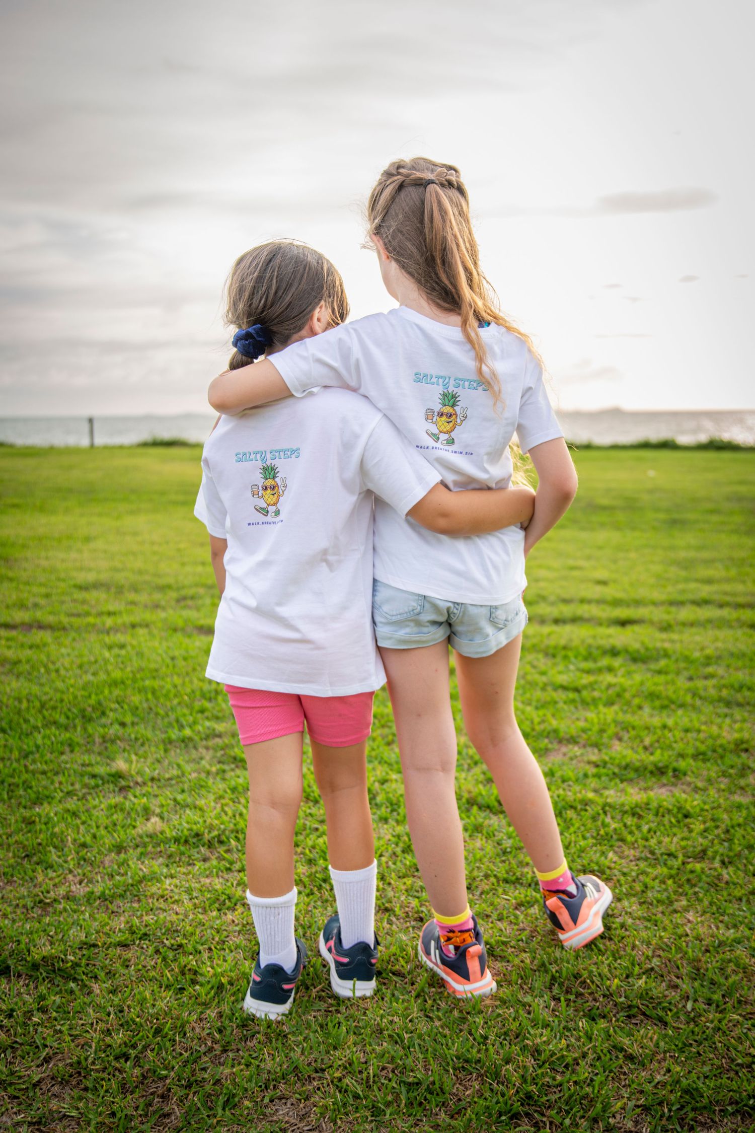 Kids posing with Salty Steps shirts during Yeppoon community event