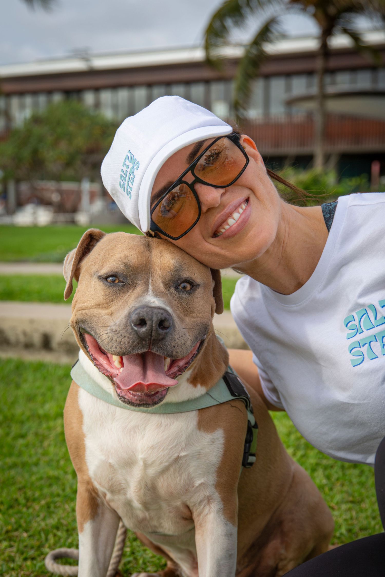 Dog and its owner smiling at camera at community walking event in yeppoon