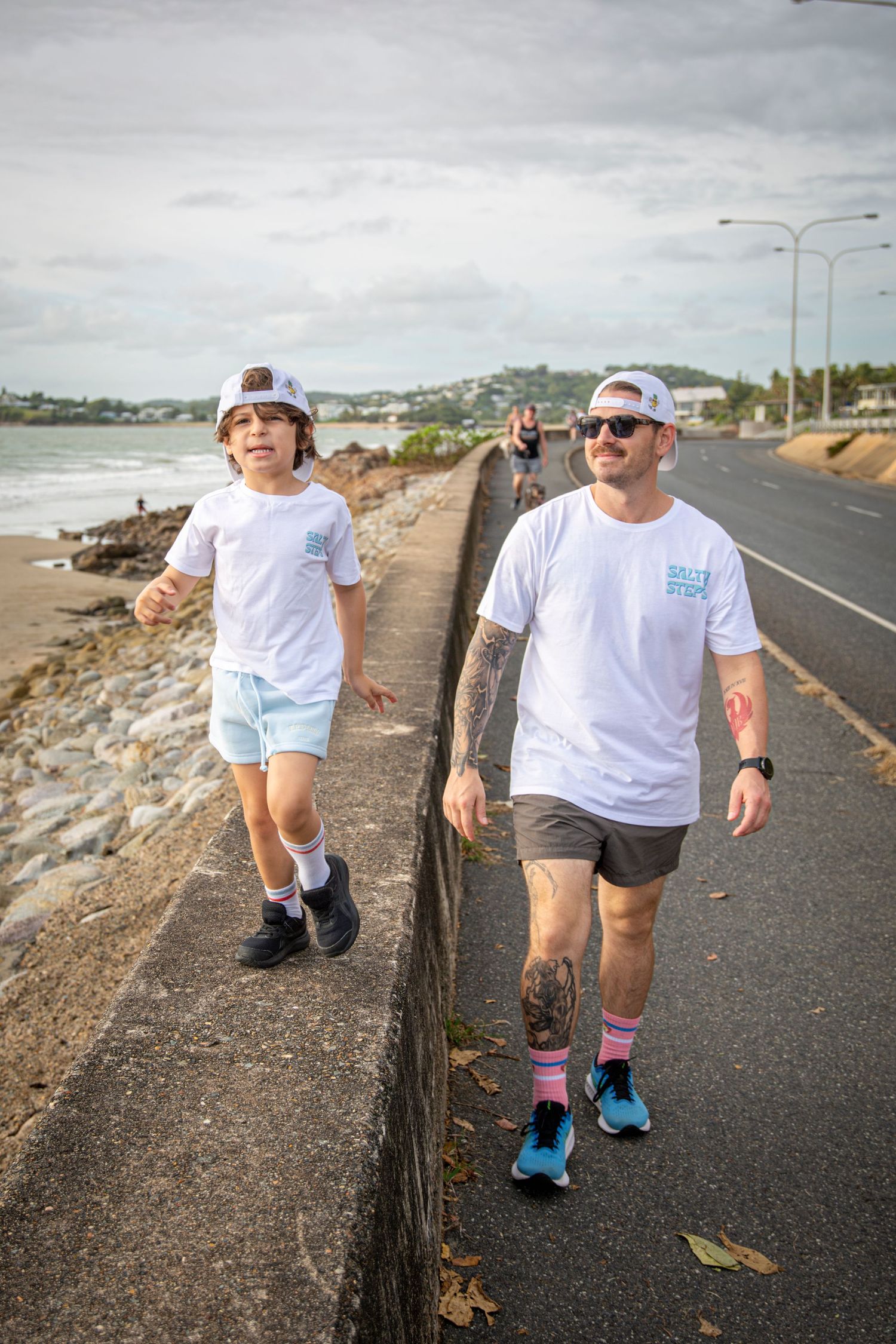Father and son walking at community event Yeppoon