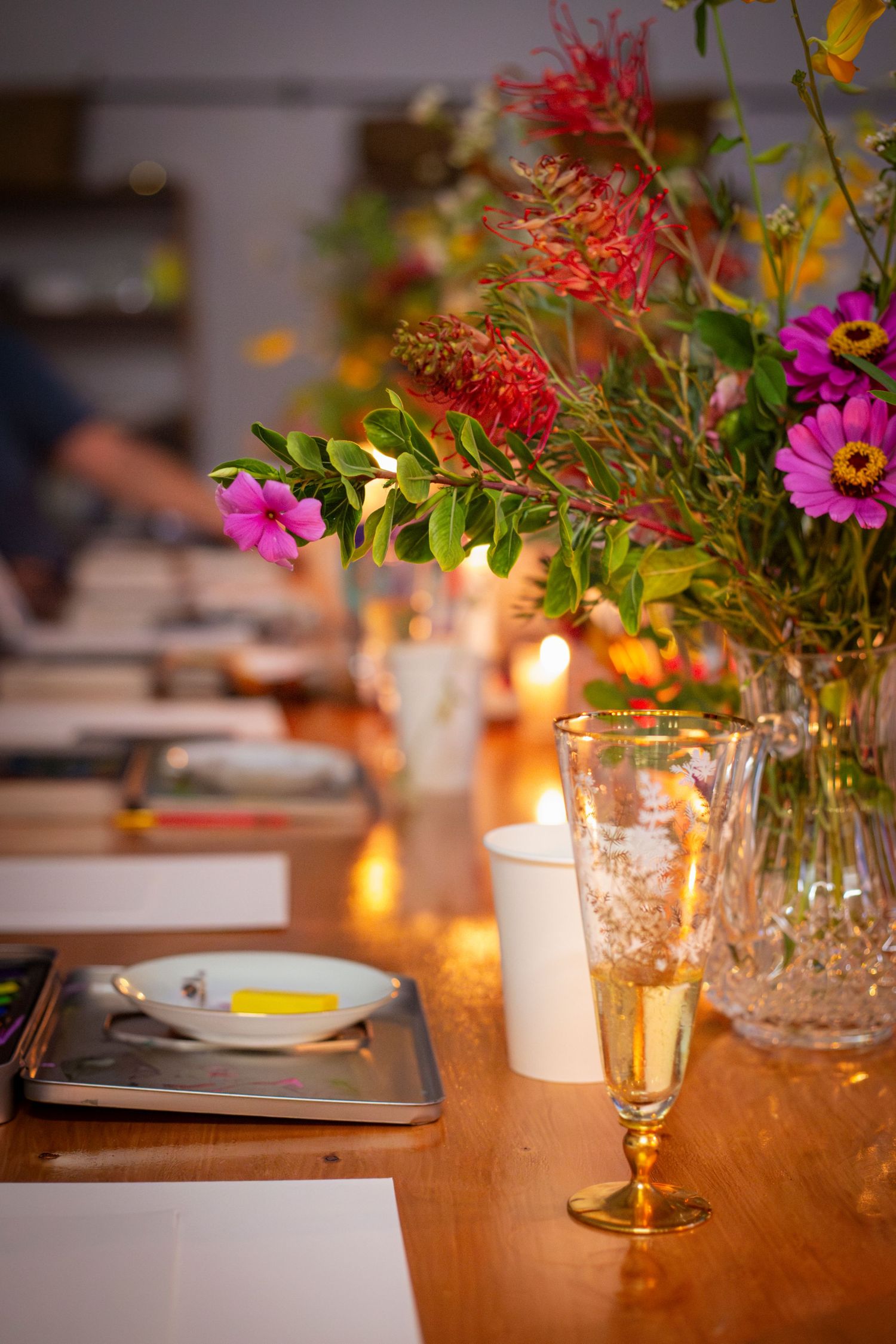 Event table decorated with flowers and candles at Rockhampton creative workshop