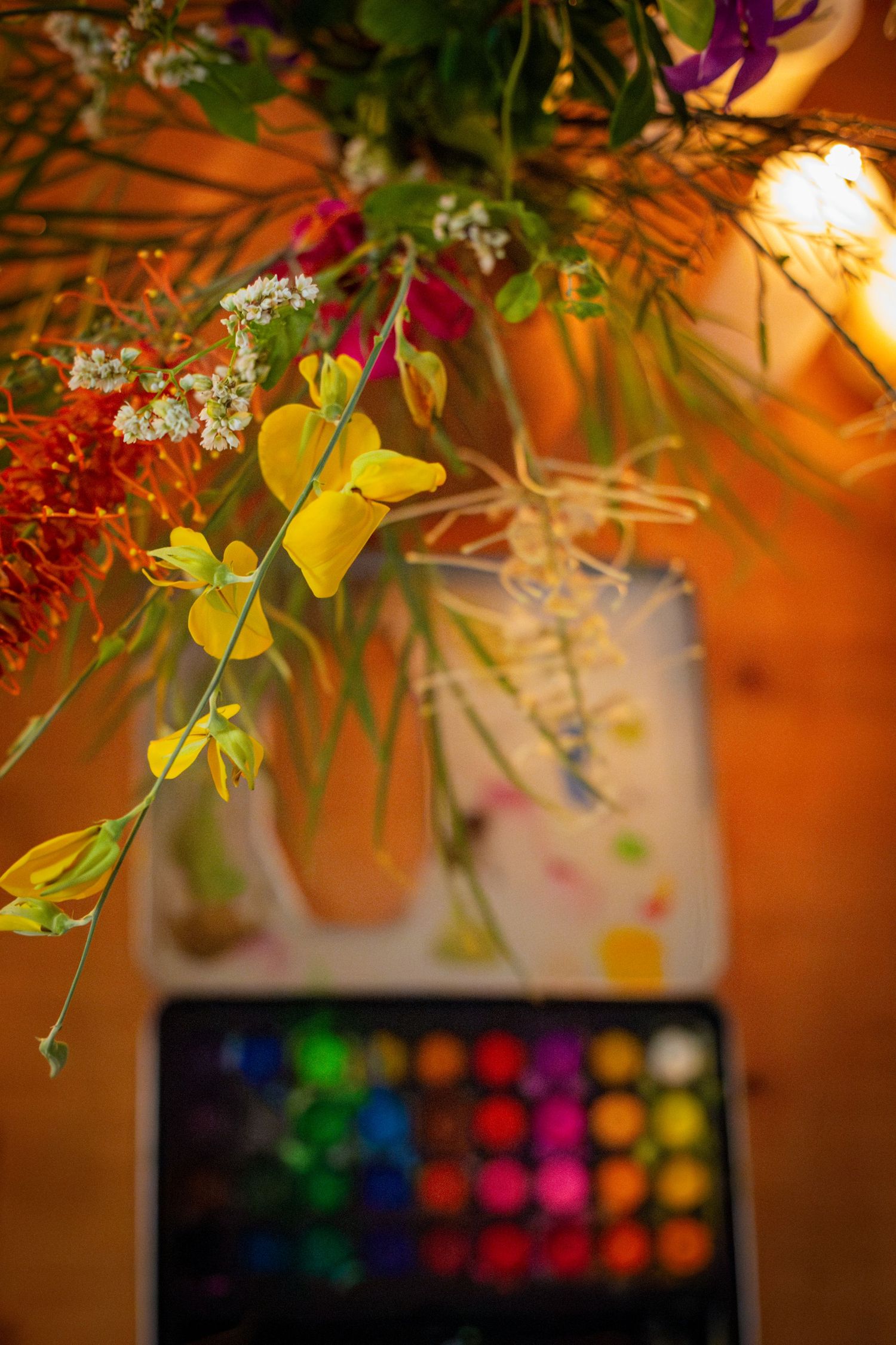 Colourful flower arrangement with moody lighting and candles during a branding shoot in Rockhampton