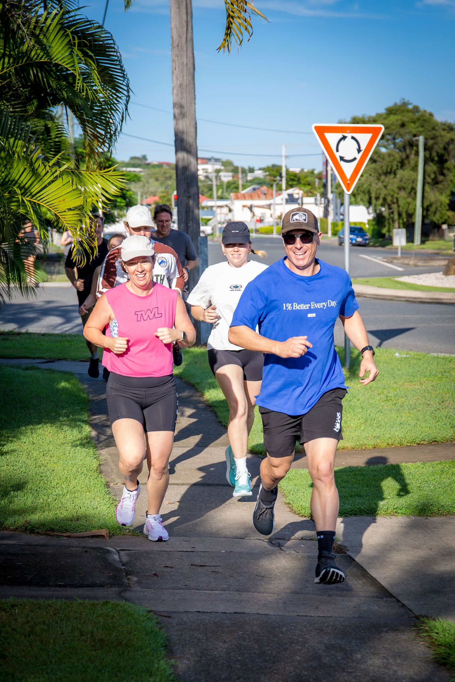 Gym members on outdoor run at CQ Fitness Co during high-energy workout