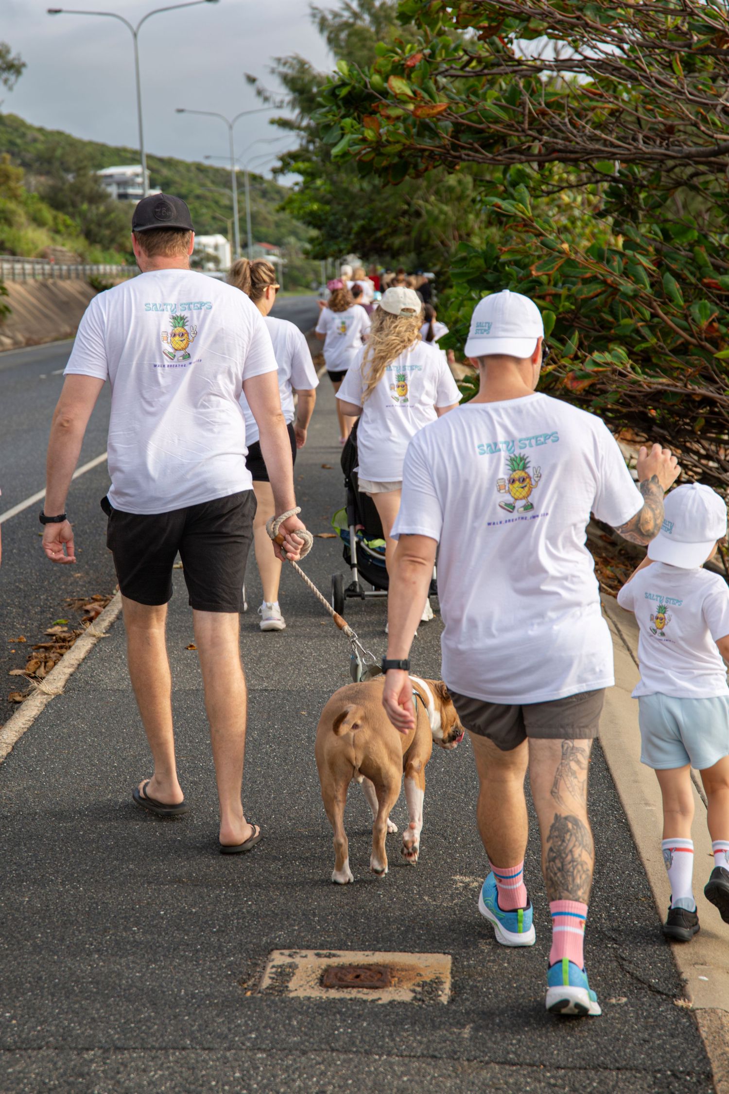 Crowd walking along coastal boardwalk at Salty Steps yeppoon