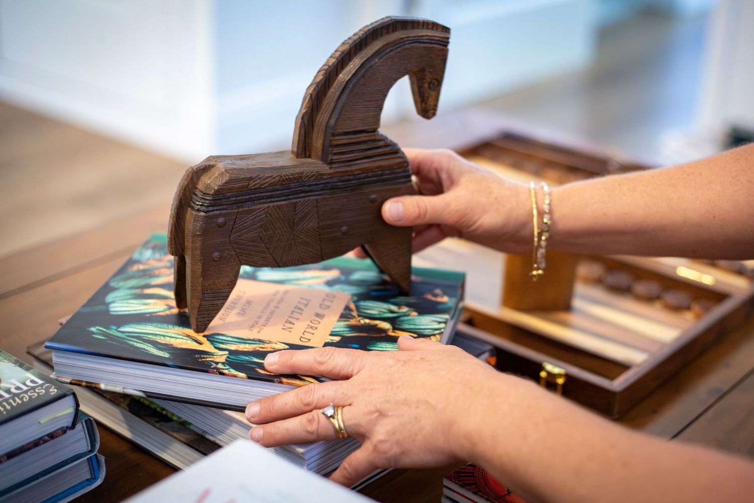 Woman adjusting table styling at branding shoot Rockhampton
