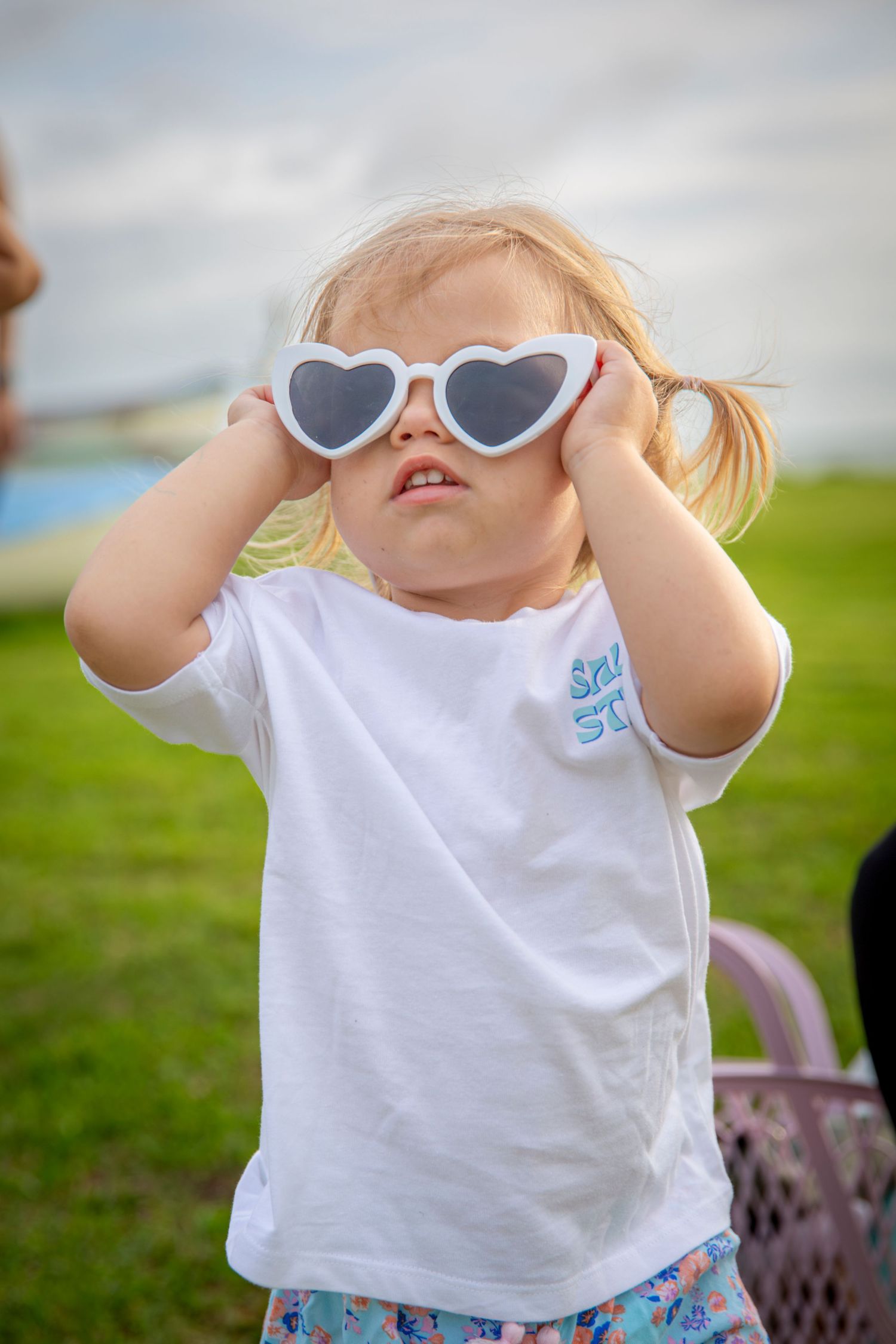 Child wearing heart sunglasses wearing salty steps shirt in yeppoon